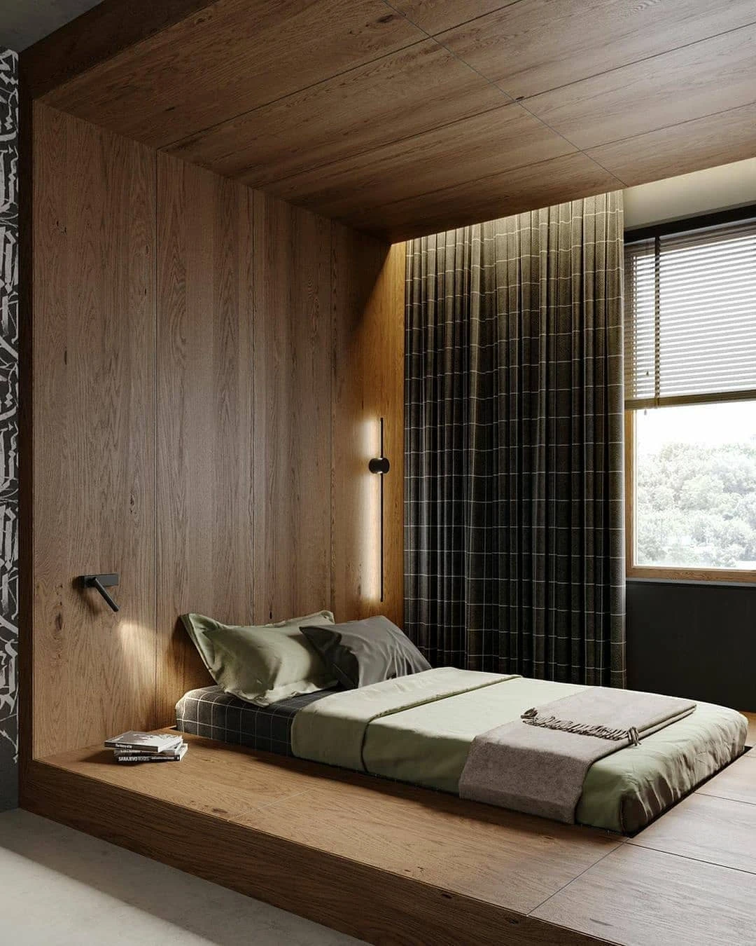 Rustic small bedroom with wooden platform bed, green bedding, wood panels, wall sconce, and curtains.