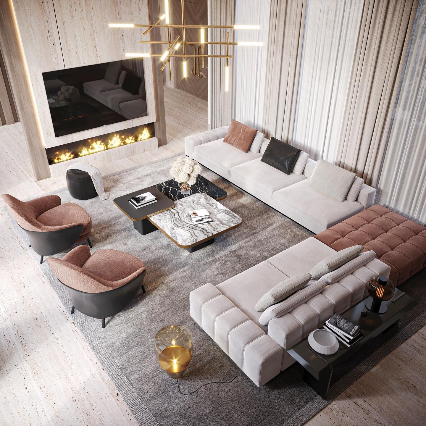 A luxurious and spacious living room with a large L-shaped sofa, a fireplace built into a wood-paneled wall, and a striking gold chandelier.