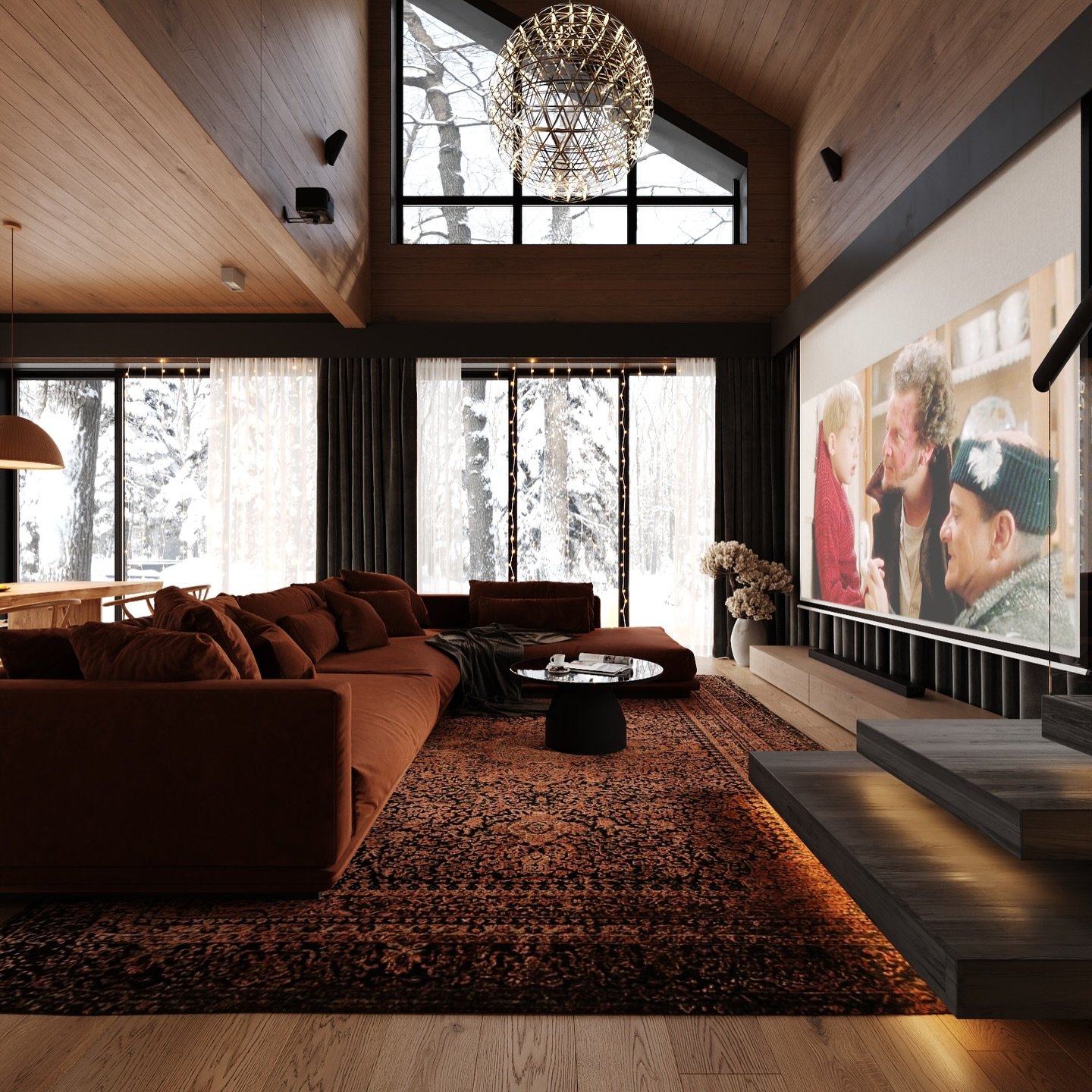 A cozy and luxurious living room with a large rust-colored sectional sofa, a big projection screen for movies, and a dramatic beaded chandelier under a high, wood-paneled ceiling.