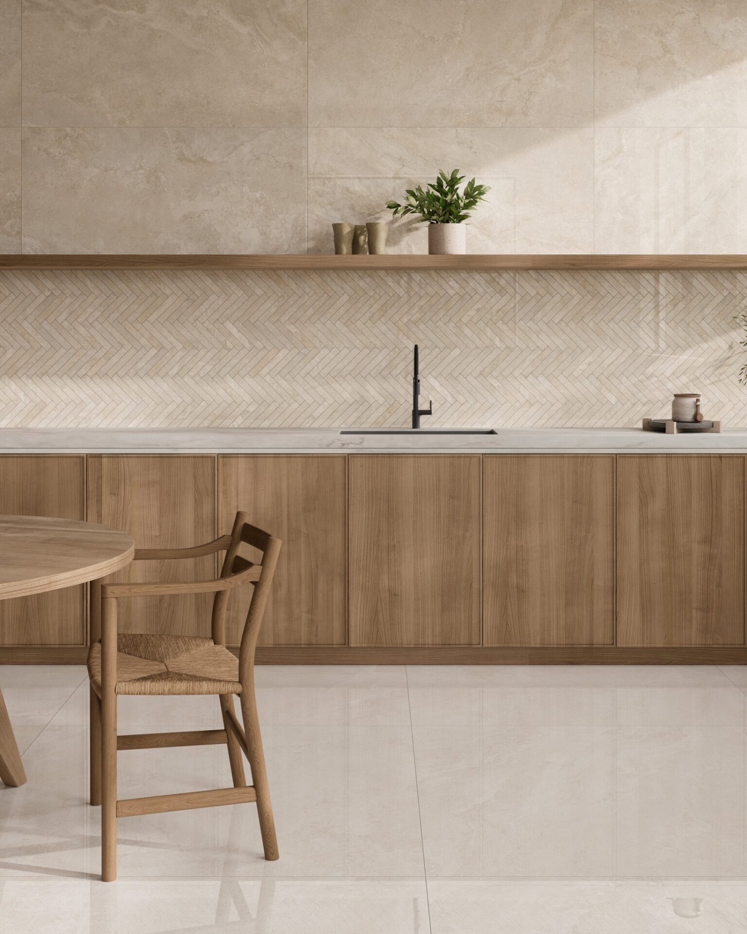 A minimalist kitchen featuring a backsplash with small, light beige herringbone tiles, complemented by a light wood cabinet and countertop.