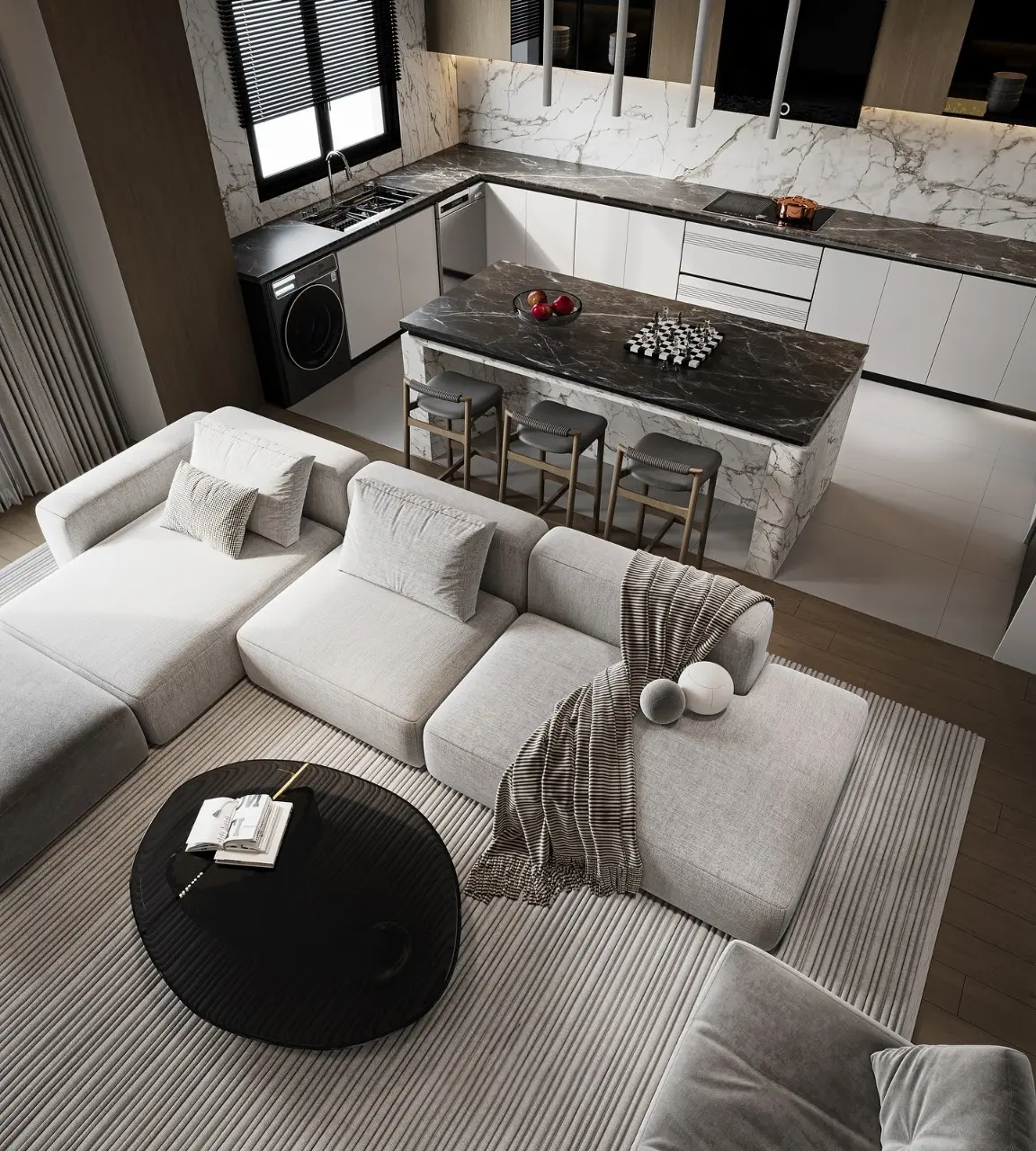 A luxurious, high-angle view of a modern open-concept kitchen and living room. The living area features a large light grey sectional sofa and a round black coffee table on a striped rug. The kitchen has a stunning black marble island with three stools and white marble backsplash and countertops.