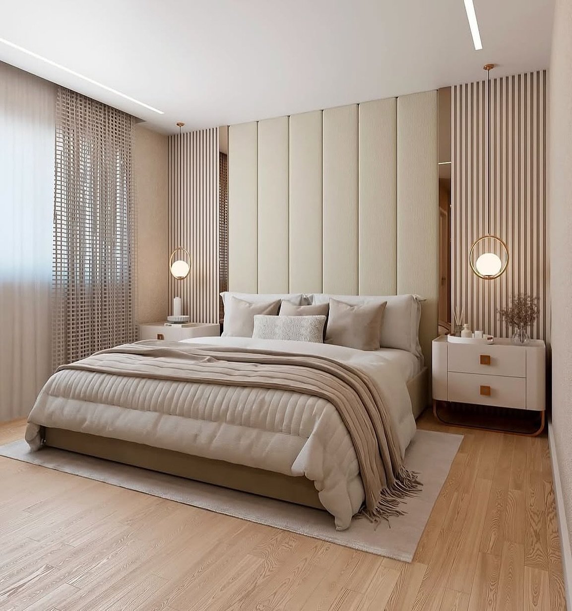 A modern master bedroom with a large bed, a symmetrical feature wall with vertical upholstered panels, and hanging globe pendant lights.