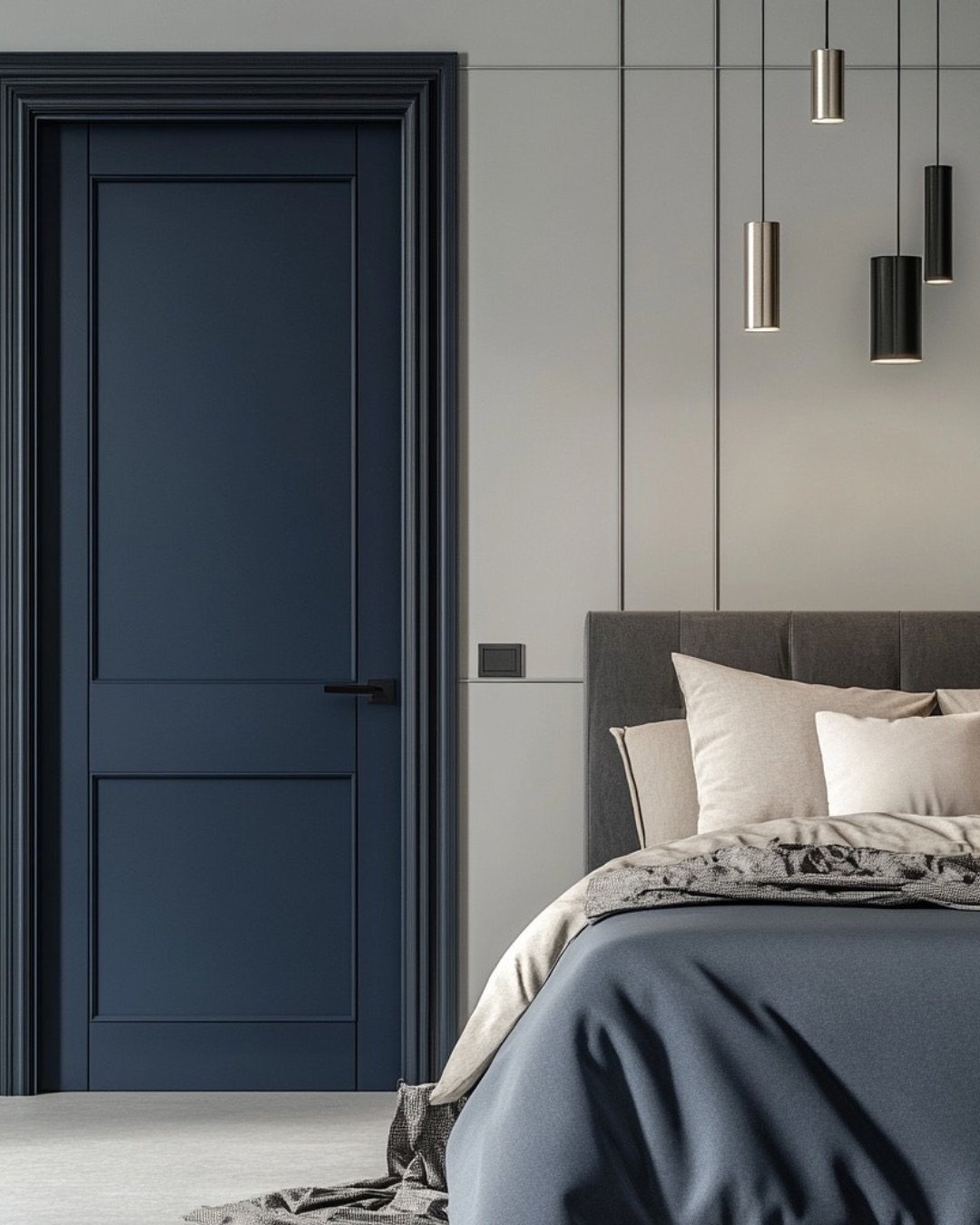 A modern bedroom door with two panels, painted in a deep matte navy blue, framed by a matching casing and featuring sleek black hardware.