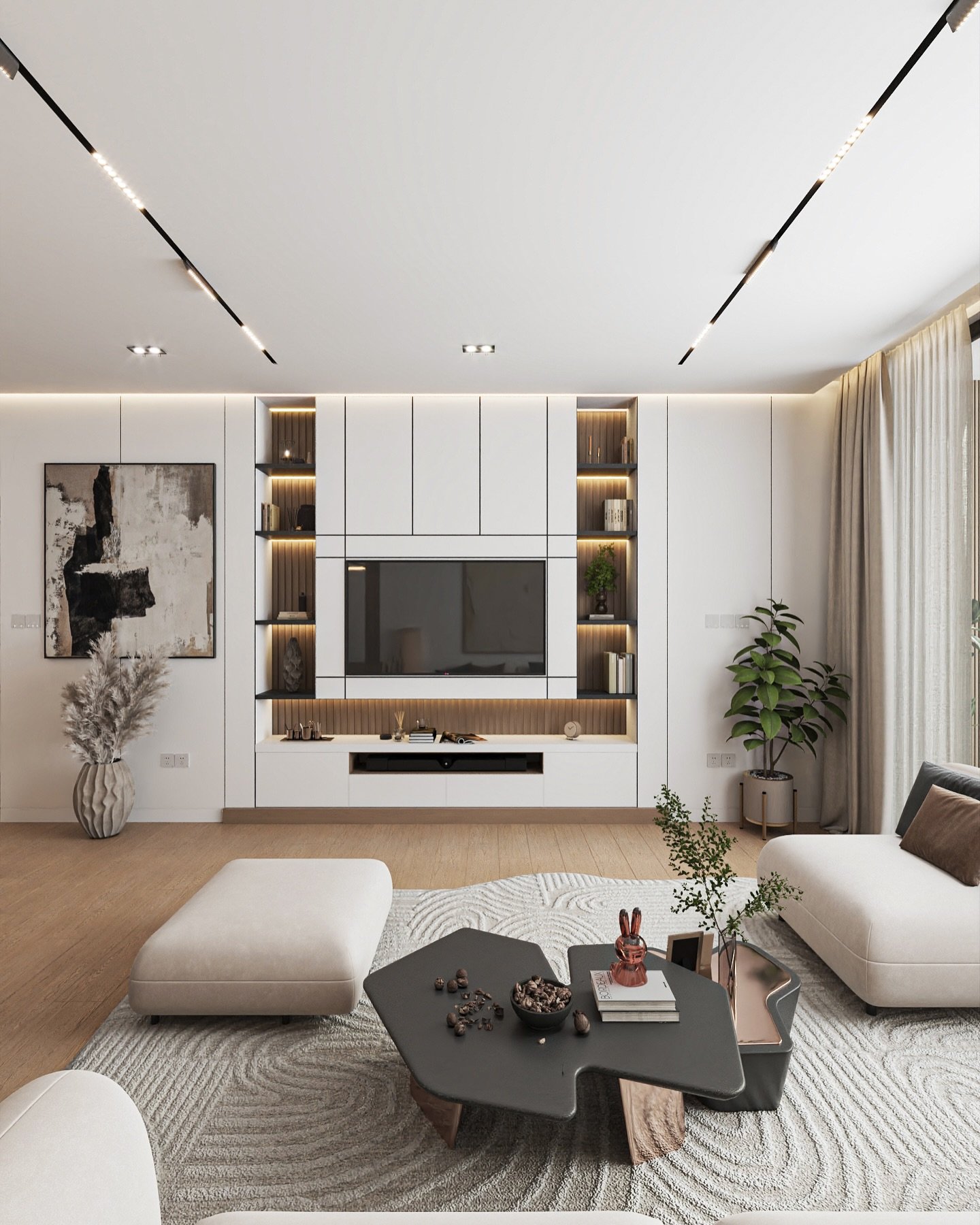 A contemporary living room featuring a white modular sofa, an abstract-shaped dark gray coffee table, and a built-in media unit with a television and illuminated shelves.