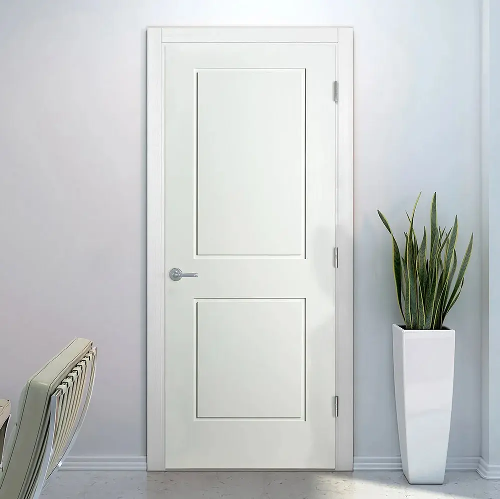 A pristine white bedroom door with a two-panel Shaker style design and a sleek chrome lever handle, set in a minimalist white room.