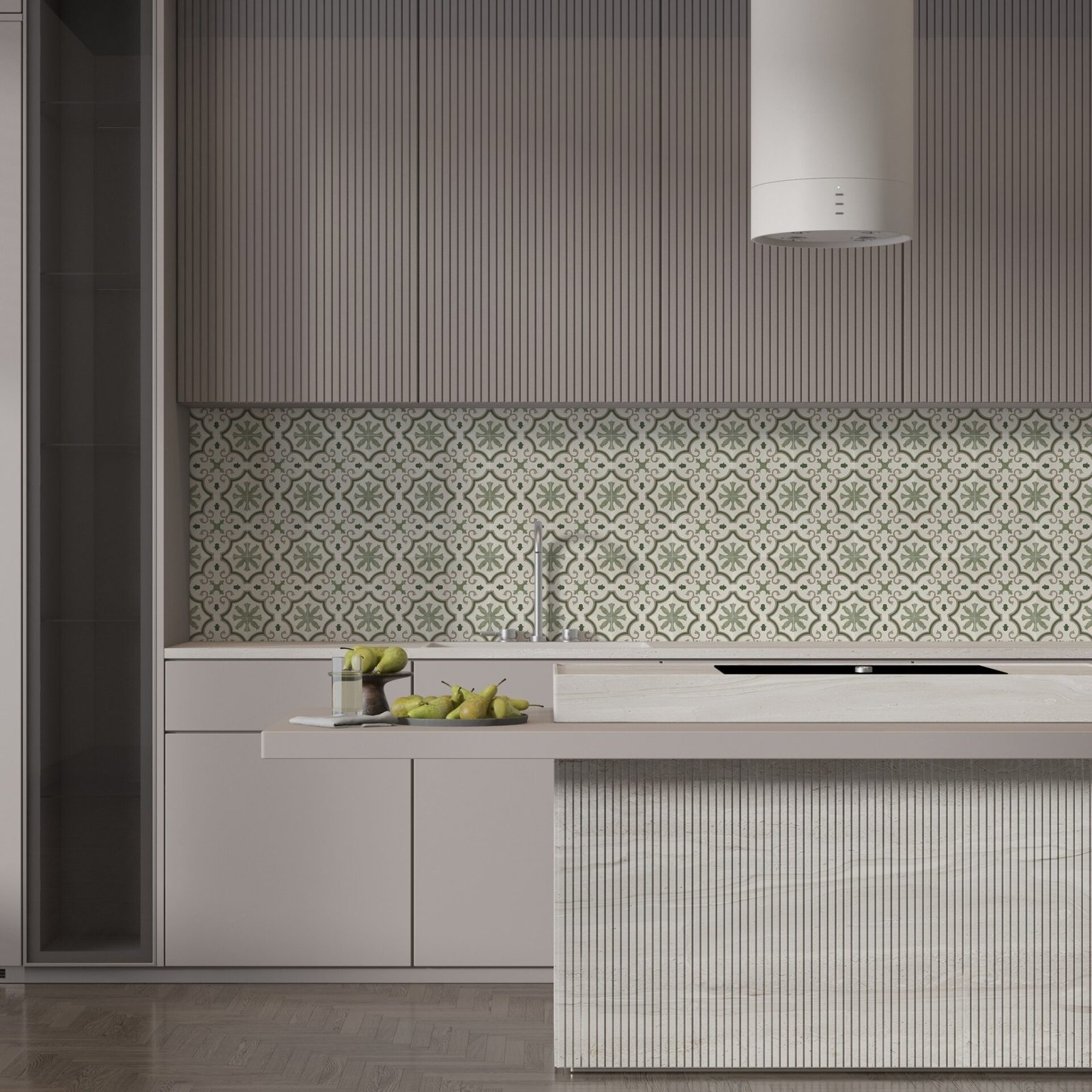 A contemporary kitchen with a backsplash of vintage-inspired patterned tiles in sage green and off-white, contrasted with smooth and fluted gray cabinetry.