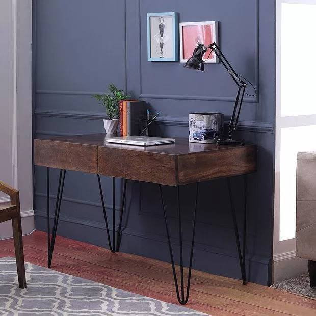 A mid-century modern-style study desk with a thick, dark wooden top and black metal hairpin legs.