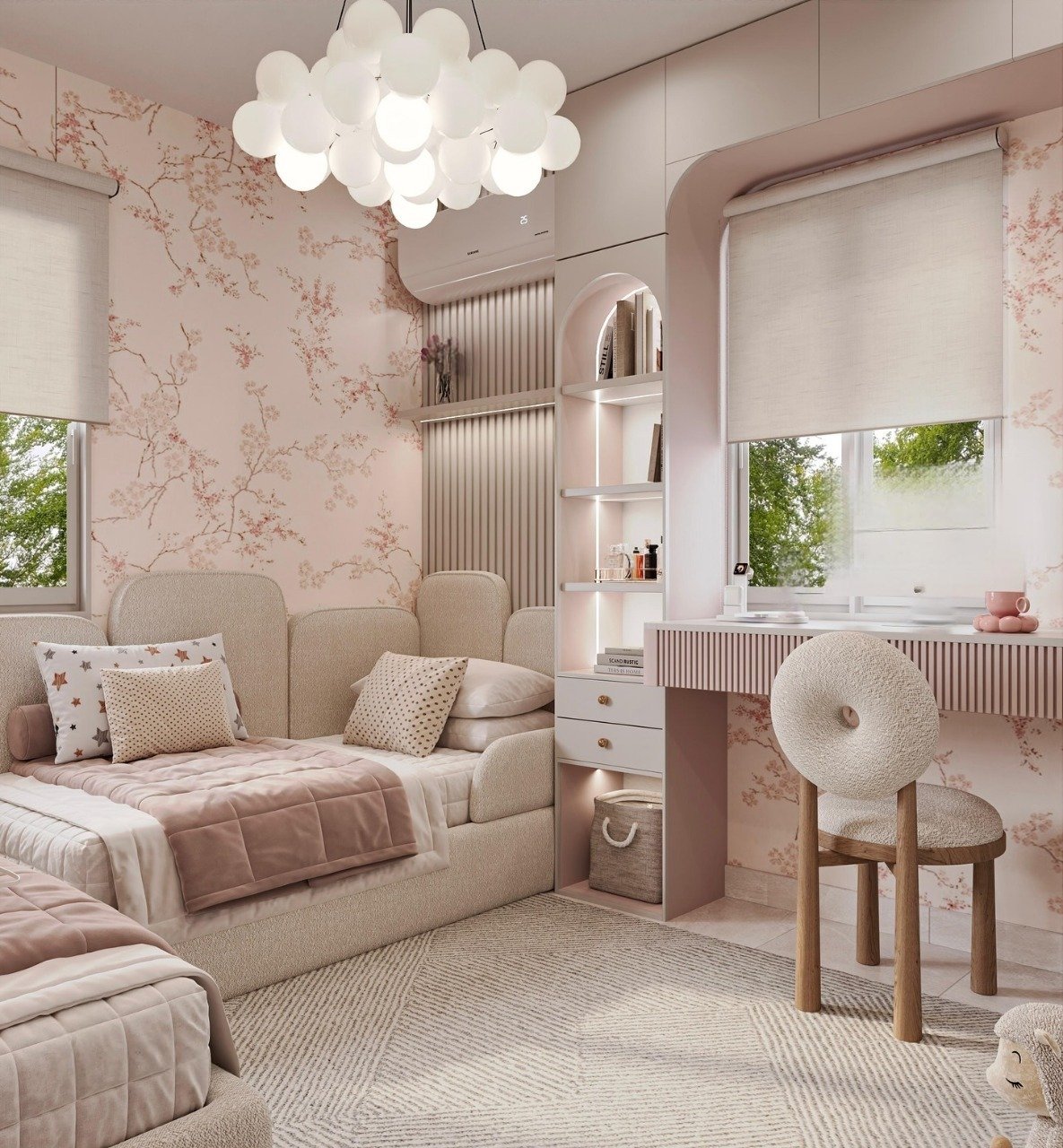 A blush pink and cream-colored bedroom with floral wallpaper, a shared built-in headboard, and a minimalist vanity.