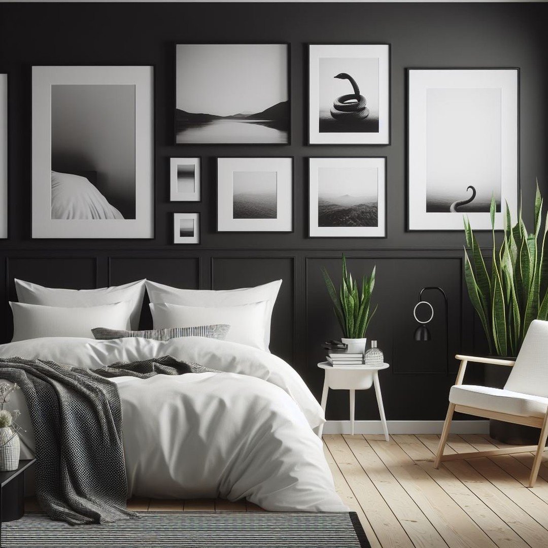 A dark and elegant bedroom with a black wainscoted wall, a gallery wall of black and white art prints, a bed with clean white bedding, and a large potted plant.
