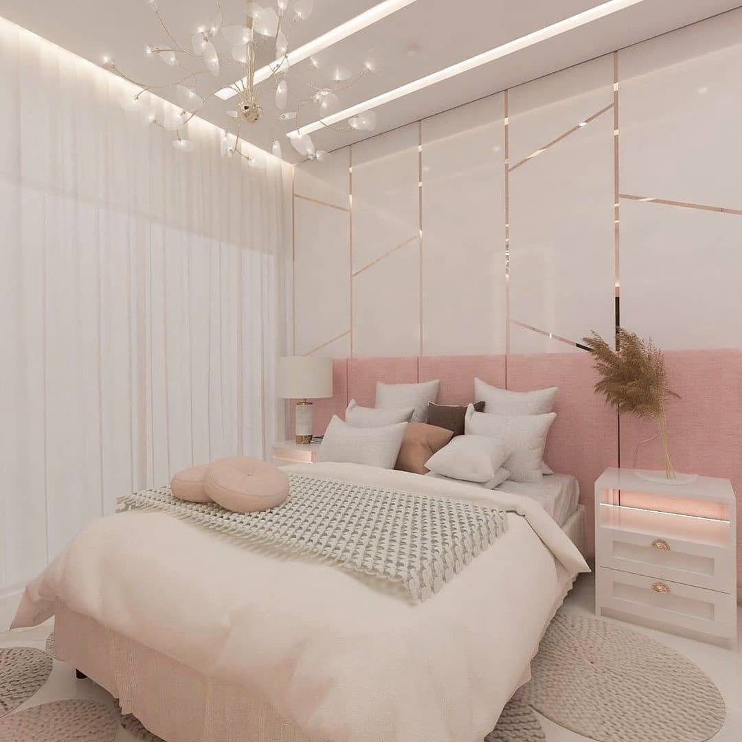A luxurious teen girl's bedroom with a blush pink and white color scheme, featuring a rose gold geometric wall and a stunning chandelier.