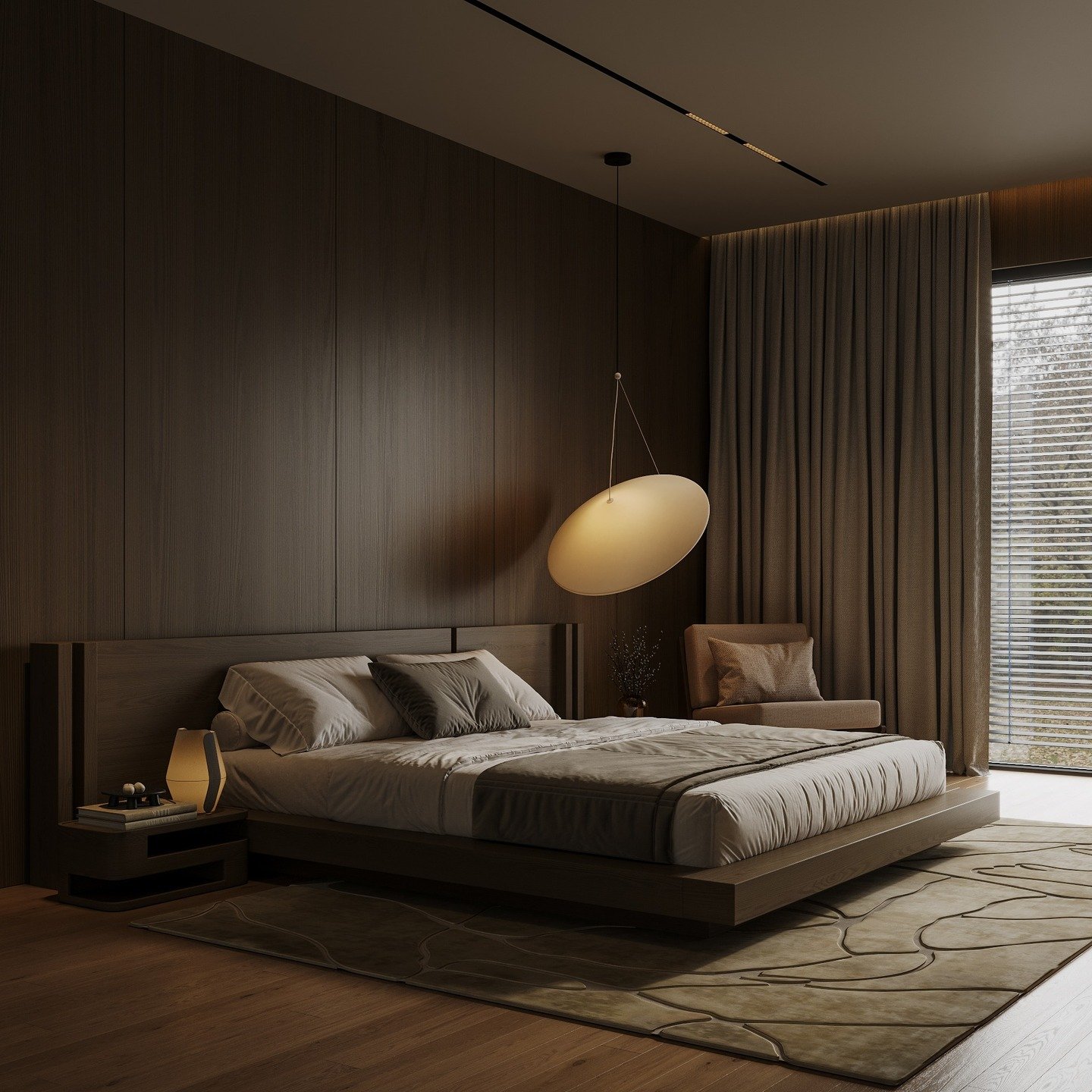 A dark, minimalist bedroom with a low-profile bed, wooden walls, and a unique oval-shaped pendant light.
