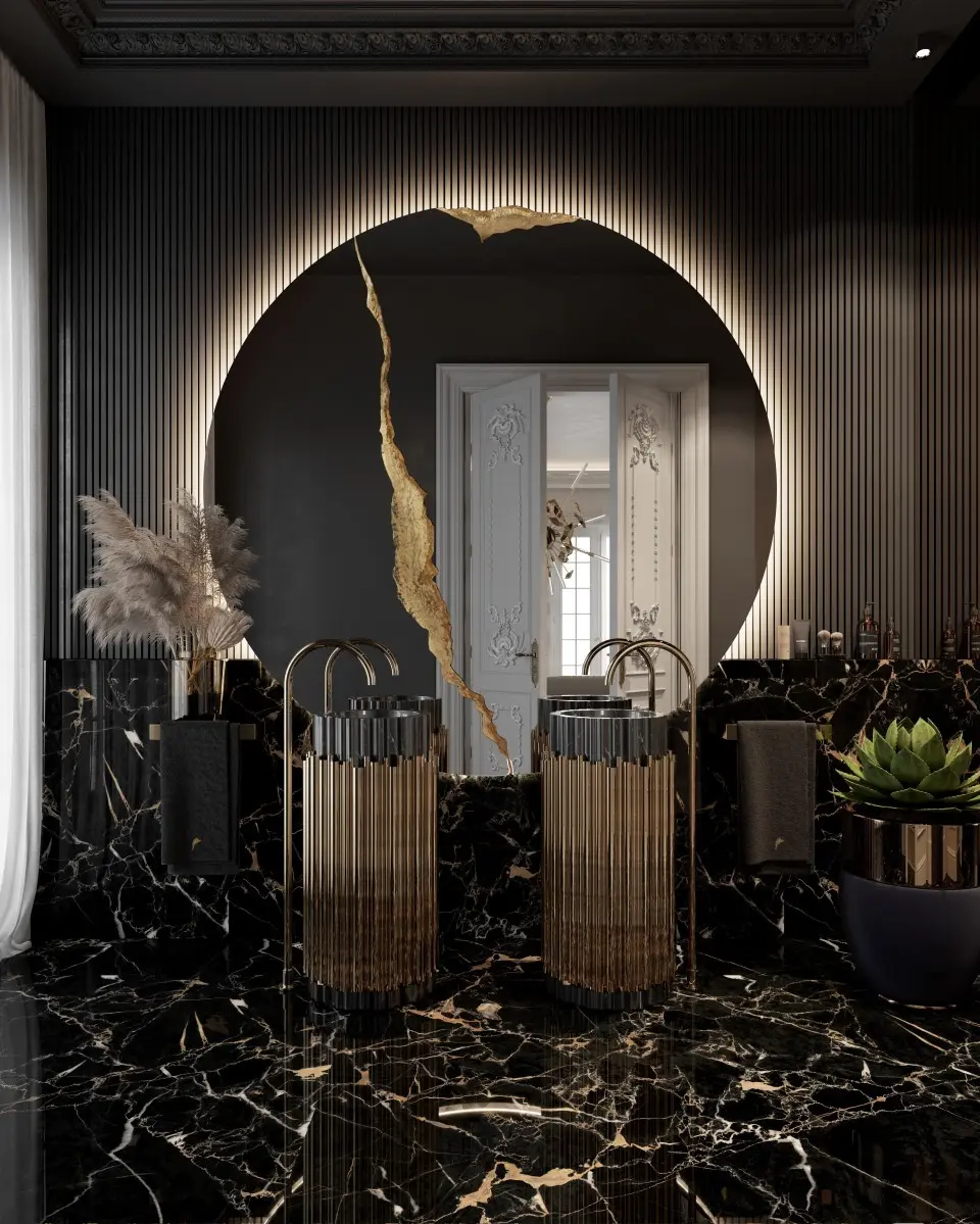 A luxurious bathroom with a large, round mirror featuring an illuminated crack filled with gold, set above a black and gold marble vanity.