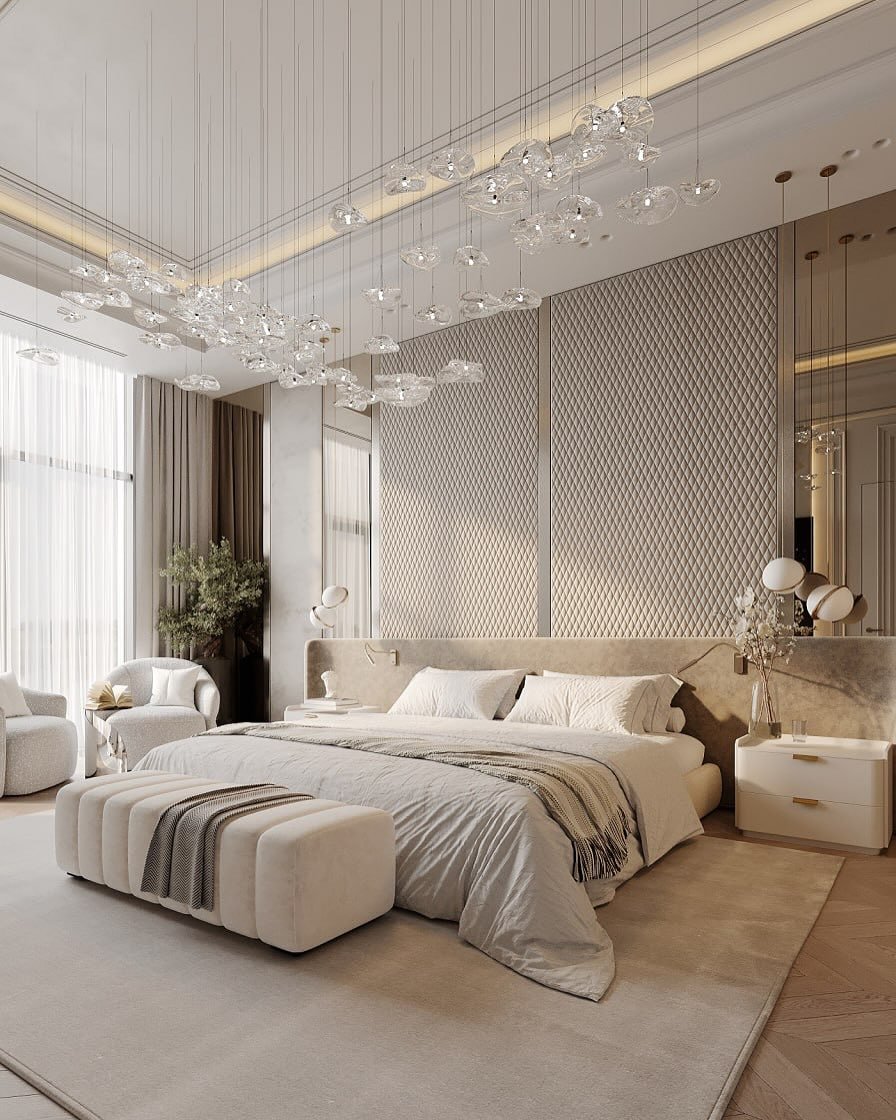  A cozy, luxurious bedroom with an oversized, sculptural chandelier made of clear glass pieces.