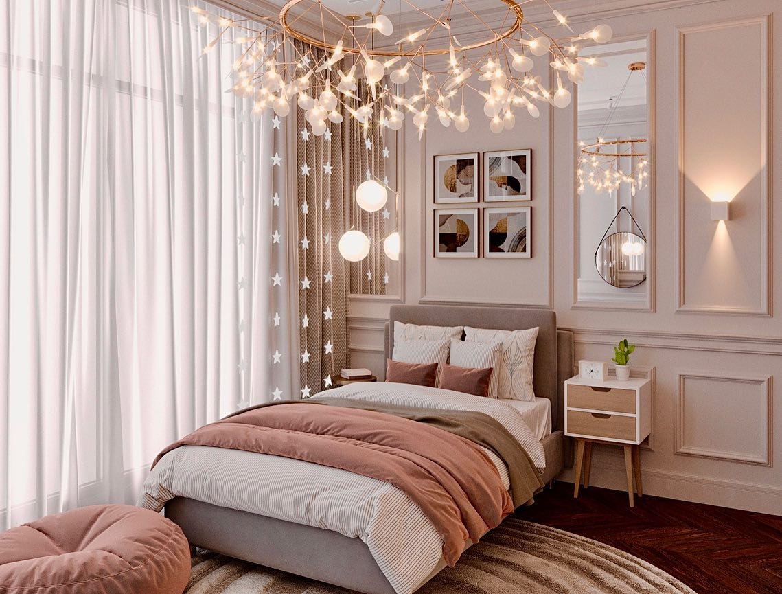 A chic and luxurious bedroom with a gray bed, a pink and gray comforter, an abstract gallery wall, and a large, artistic chandelier.