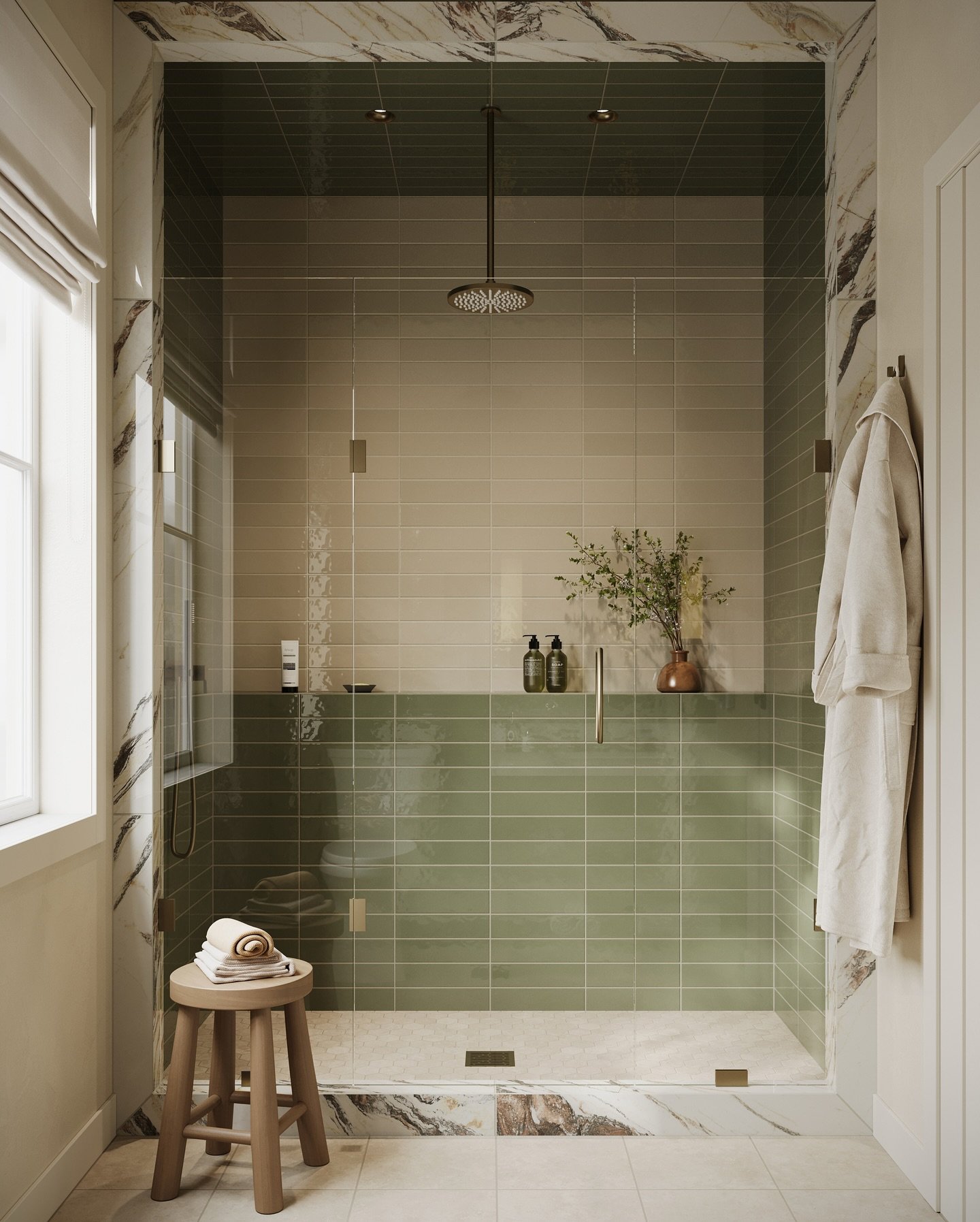 A modern walk-in shower with a two-tone tiled wall, featuring a lower section of glossy green subway tiles and an upper section of matte beige tiles, with marble accents.