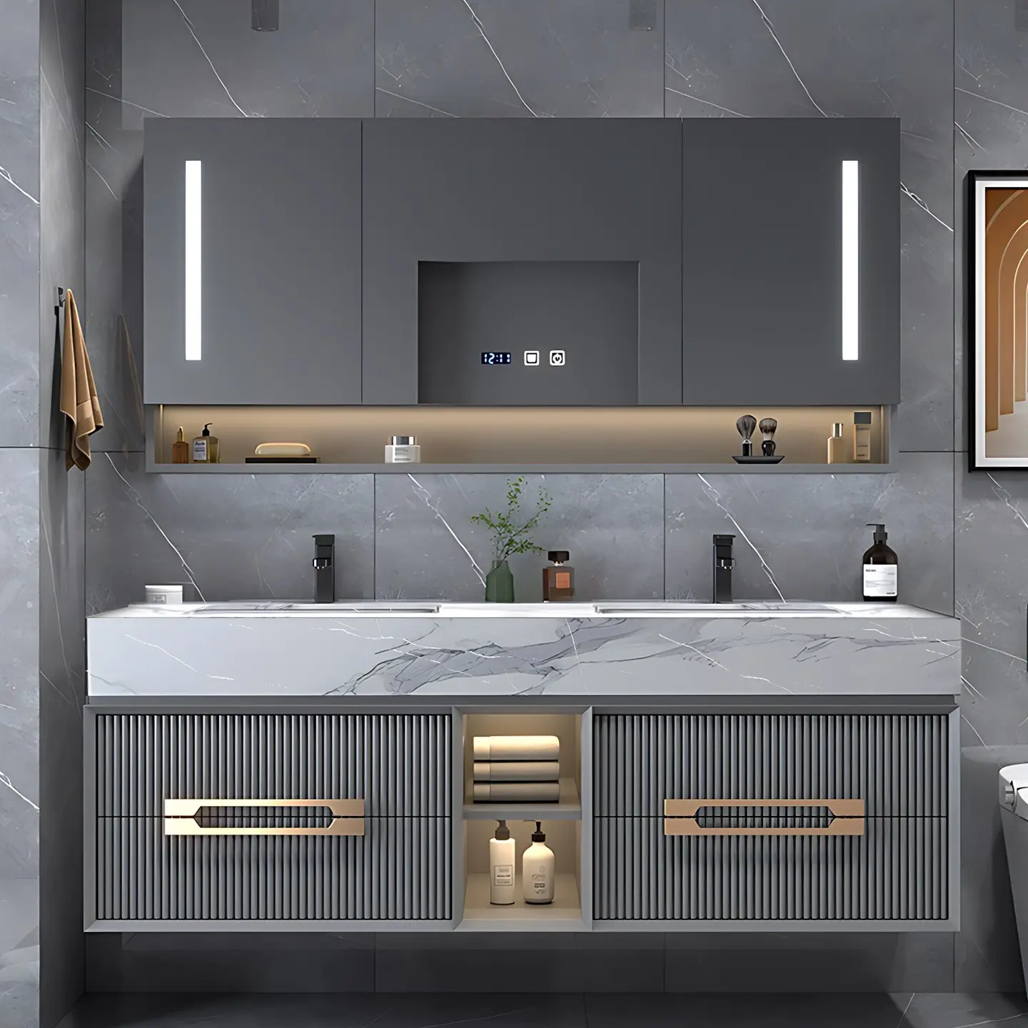 A dark gray floating double vanity with a marble-patterned top and ridged cabinet fronts with modern gold handles. A smart mirror cabinet with vertical LED lights and a digital clock hangs above, with a built-in shelf below.