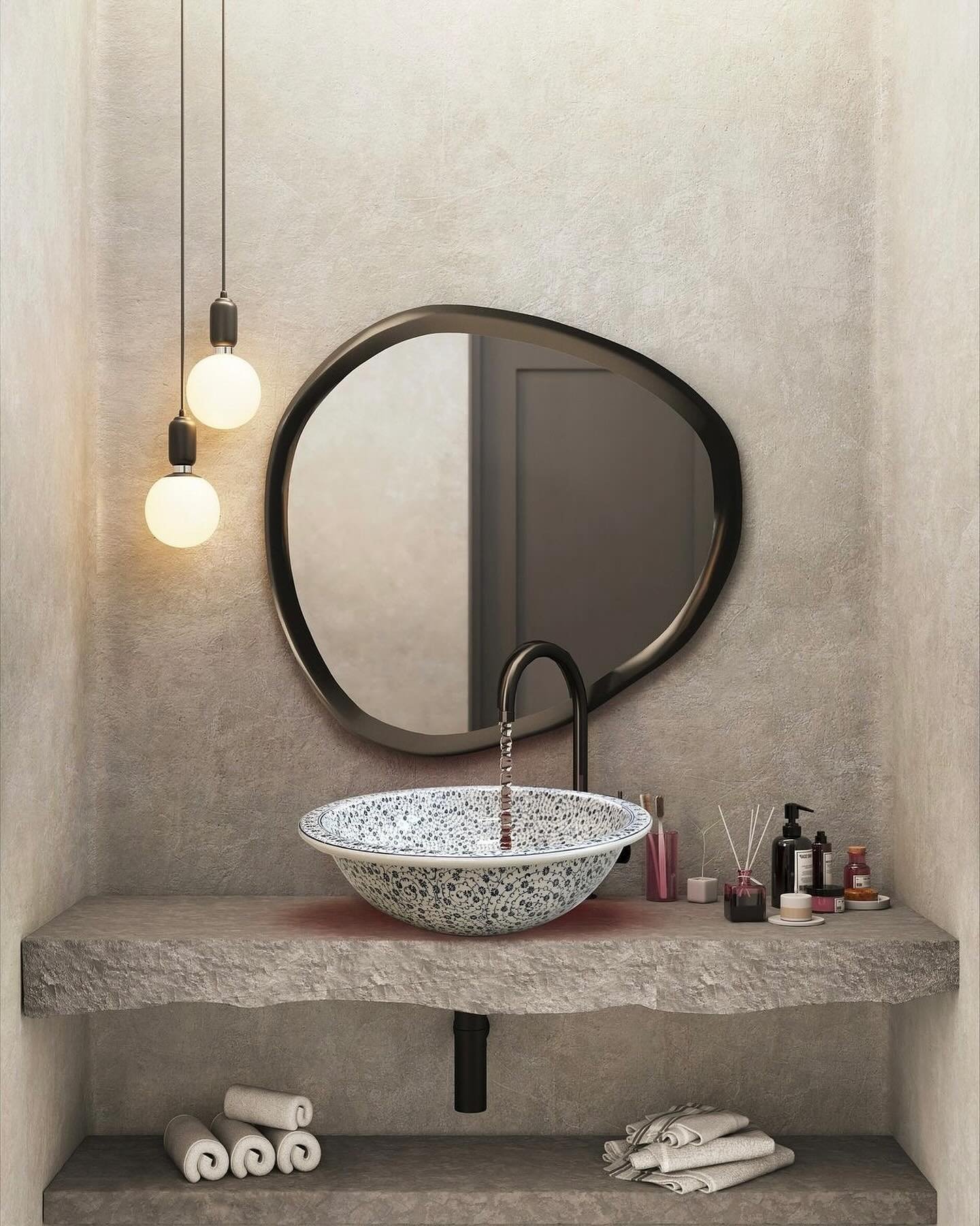 A bathroom with a decorative white-and-blue speckled vessel sink on a thick, natural gray stone countertop.
