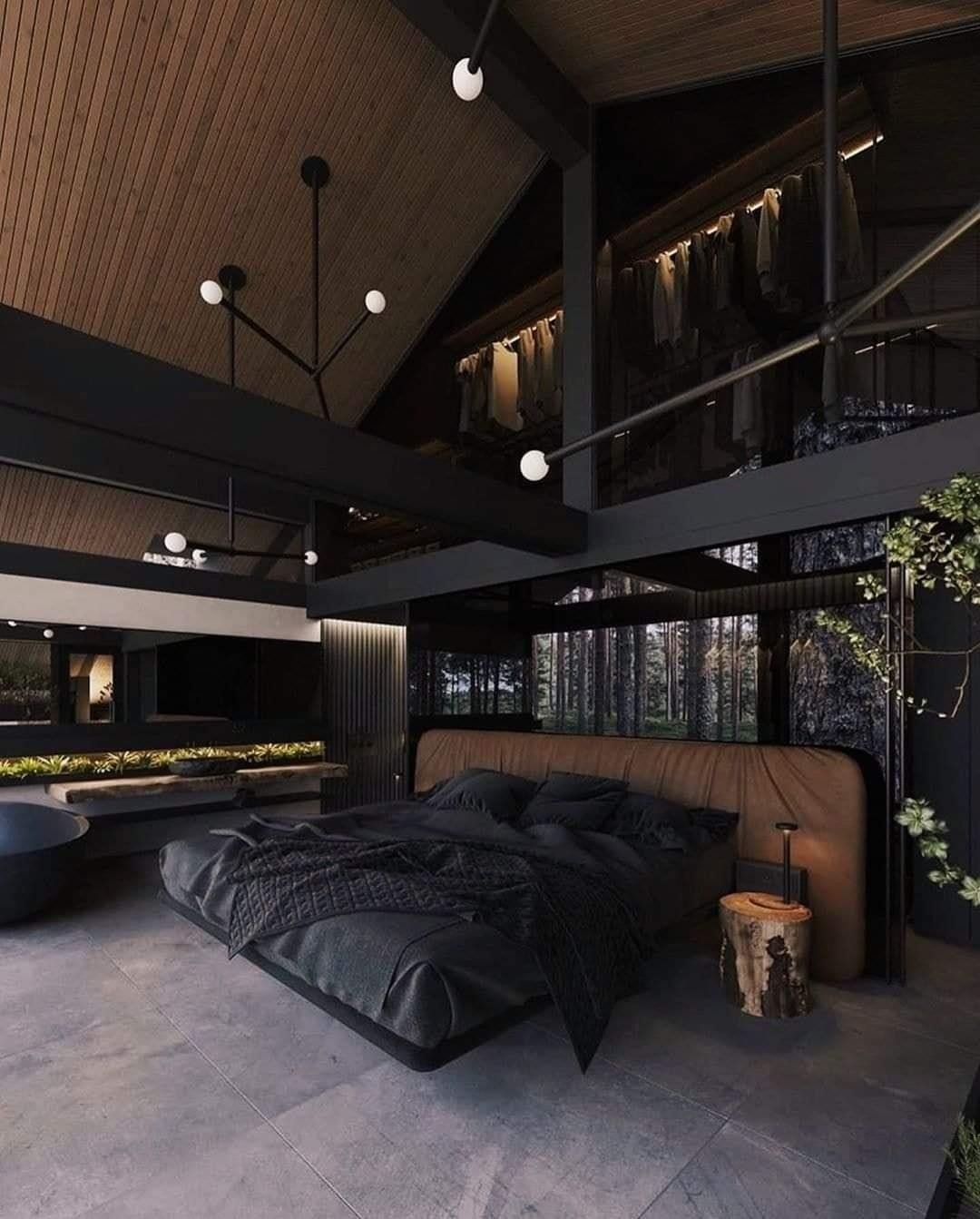A luxurious bedroom in a modern loft with a slanted wood ceiling, a floating bed, an open closet, and a large window looking out onto a forest.