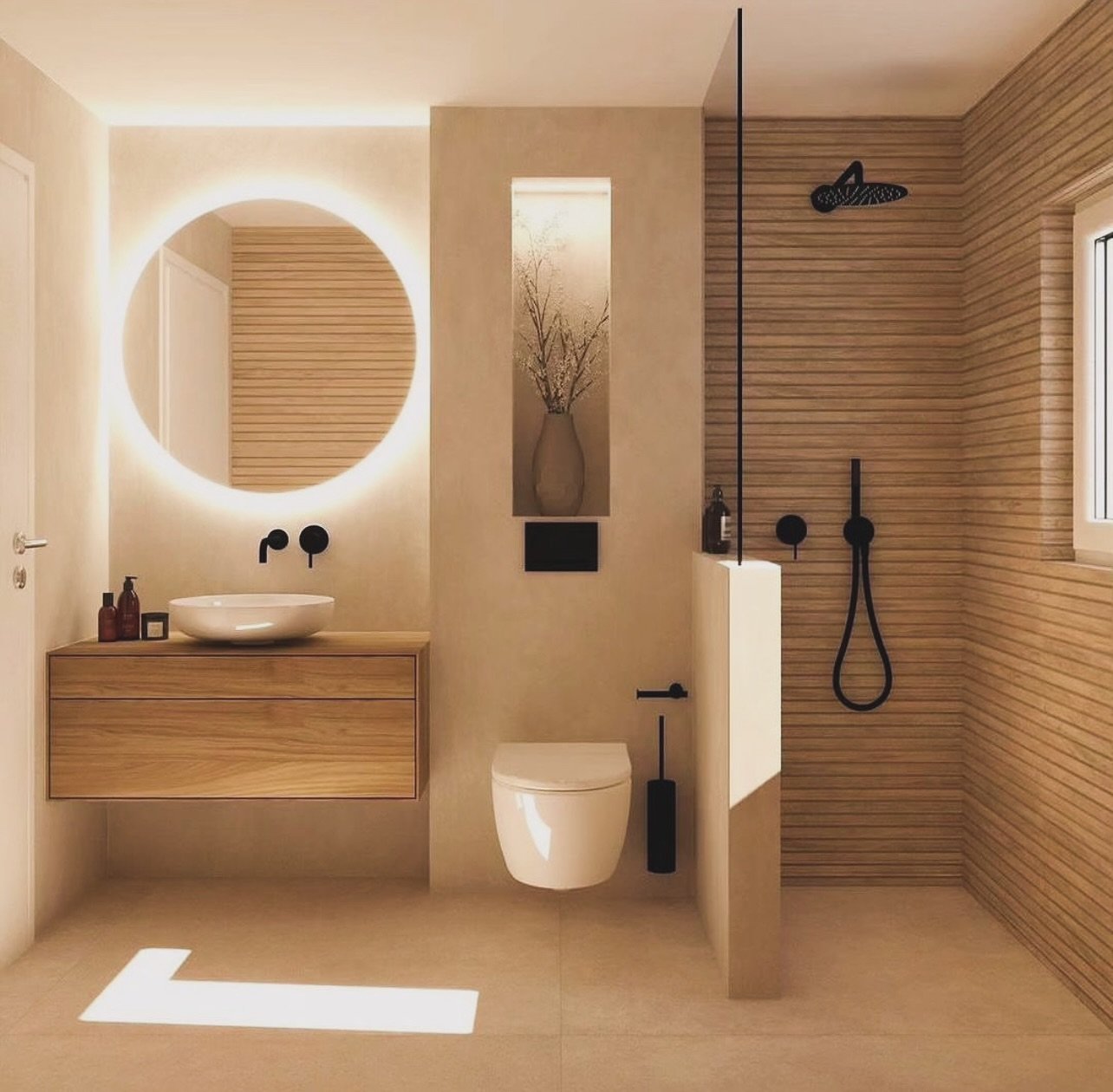 A neutral-toned bathroom with wood-effect tiles in the shower area, a circular backlit mirror, and a floating wood vanity.