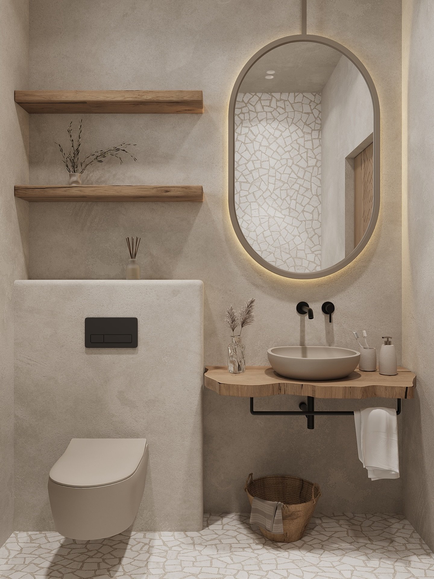 A small bathroom with an organic style, featuring a raw-edge wood vanity, a mosaic-tiled floor, and an oval, backlit mirror.