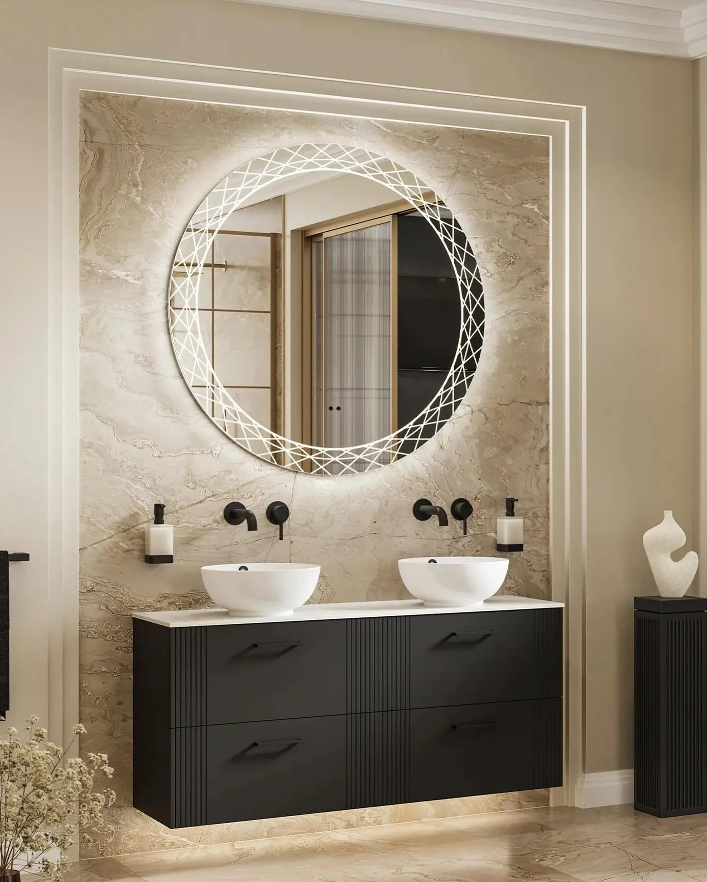 A modern bathroom with a large, round mirror featuring an illuminated geometric pattern, set above a black double vanity with two vessel sinks.