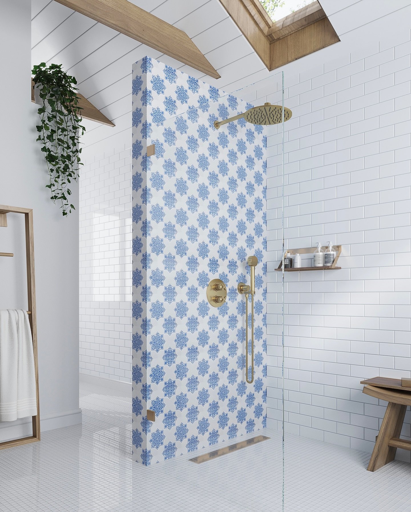 A bright, airy walk-in shower with a patterned blue and white tile divider, brass fixtures, white subway walls, and a wood-beamed ceiling.