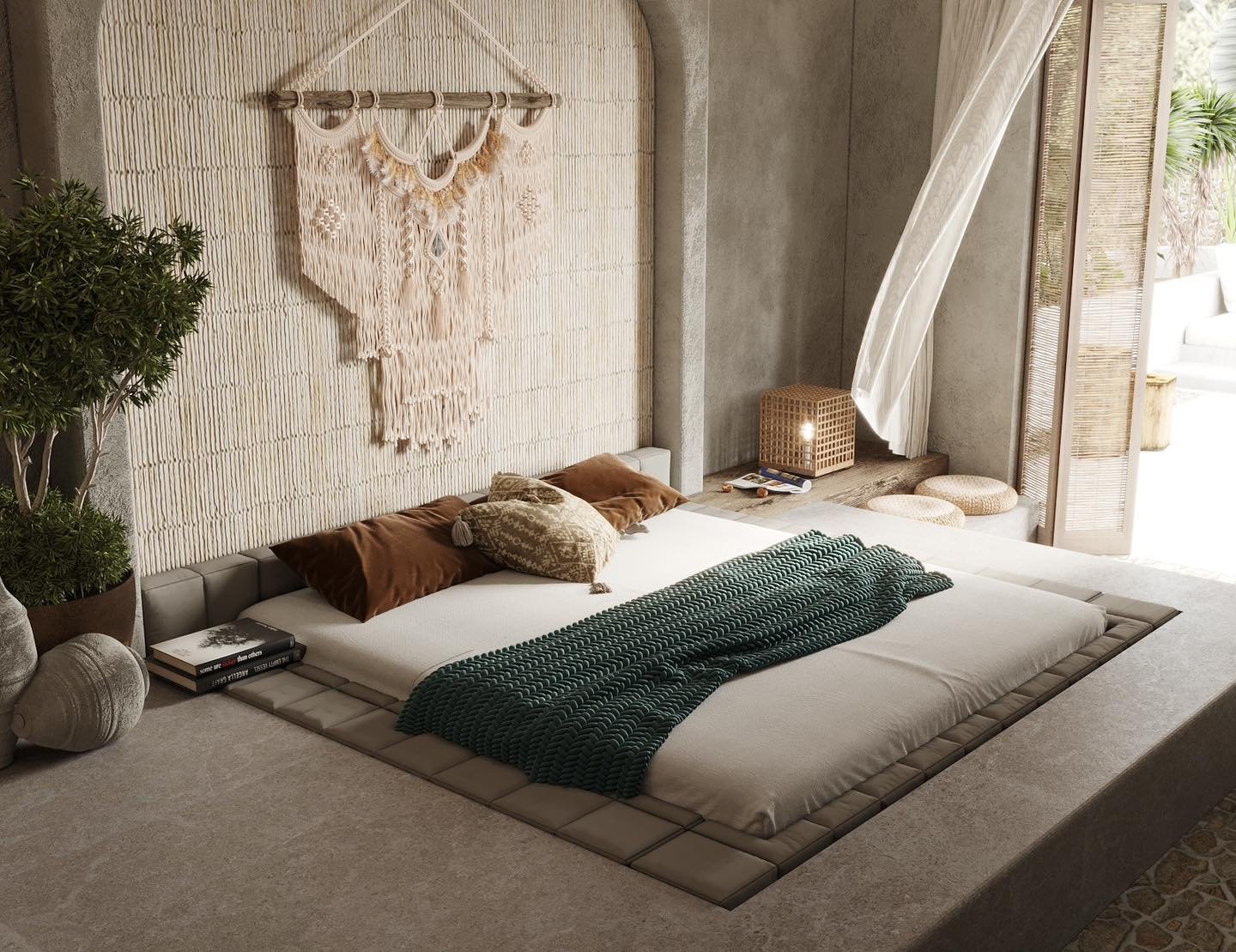 A minimalist boho bedroom with a low-to-the-ground platform bed, a macrame wall hanging, and a backdrop of bamboo slats.