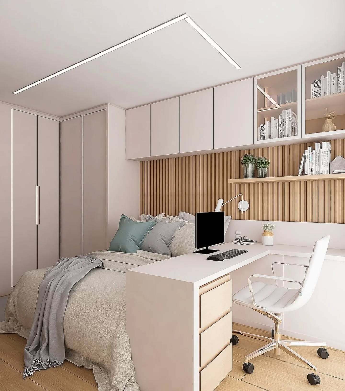 A small, modern bedroom featuring a light wood slatted wall behind the bed and an L-shaped desk, with white closed cabinets and glass shelving above.