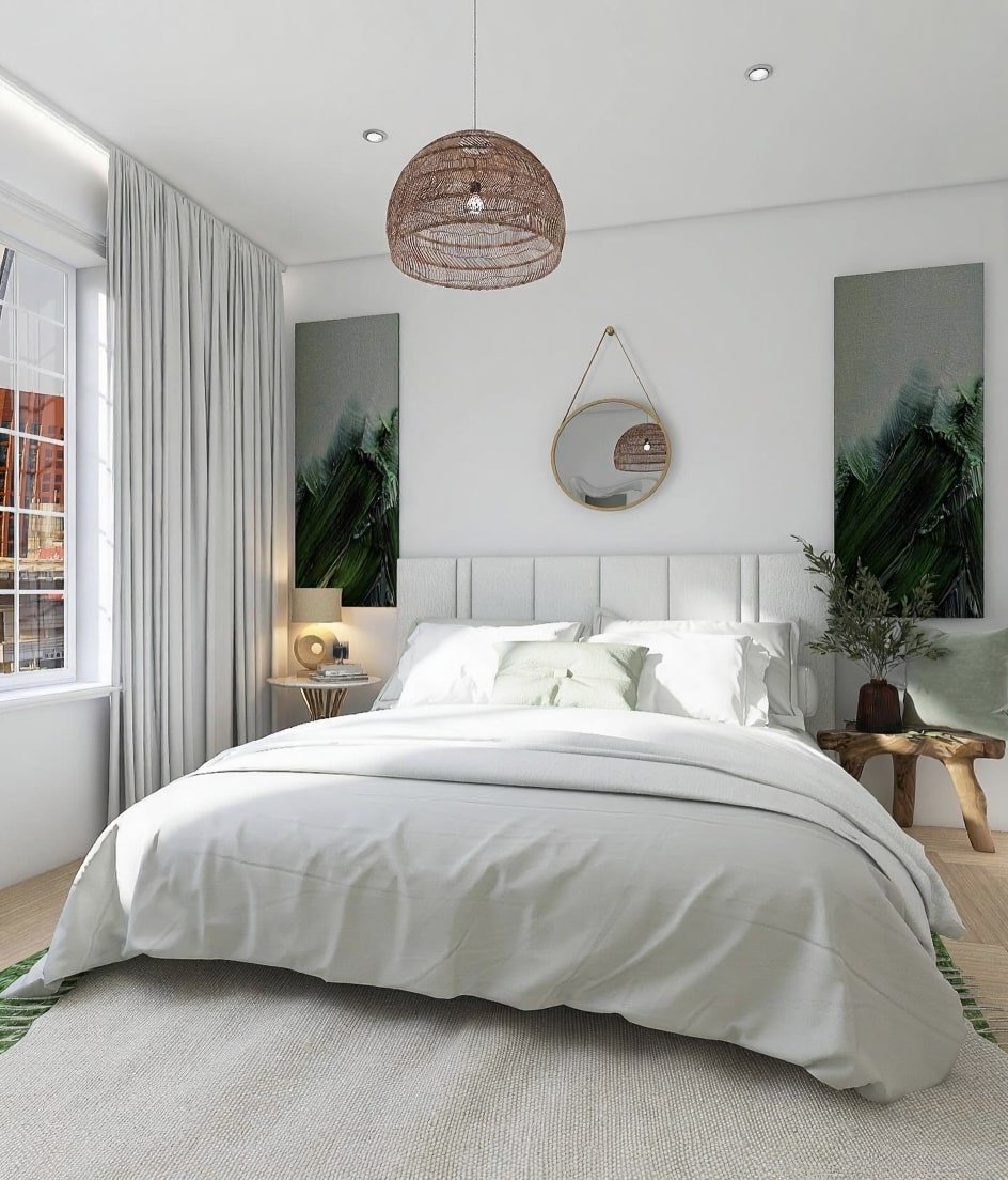 Bright, minimalist white bedroom with green abstract art panels and a woven rattan light fixture.