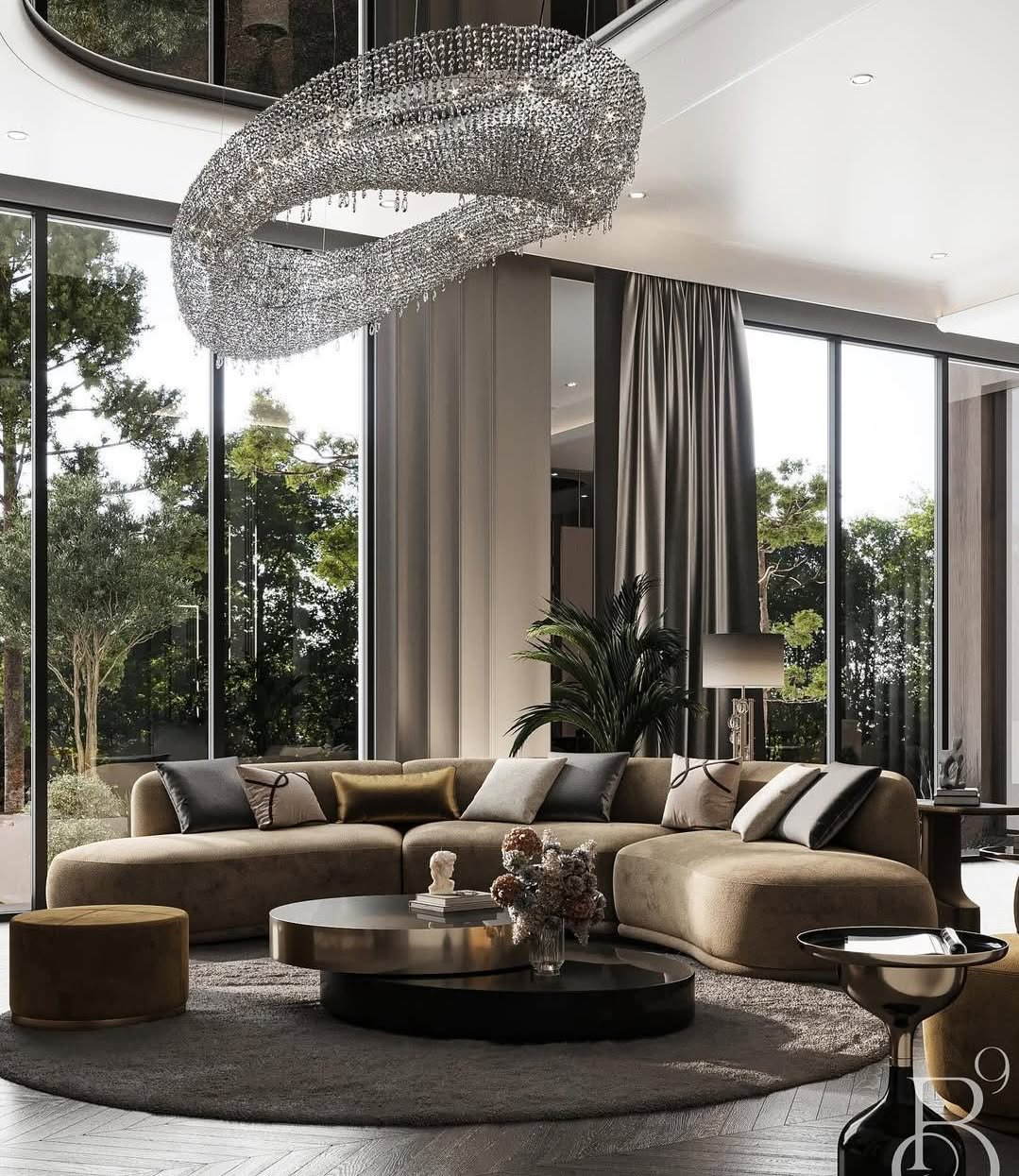 Luxury living room with curved beige velvet sofa, floor-to-ceiling windows, and a large, sparkling crystal ring chandelier.