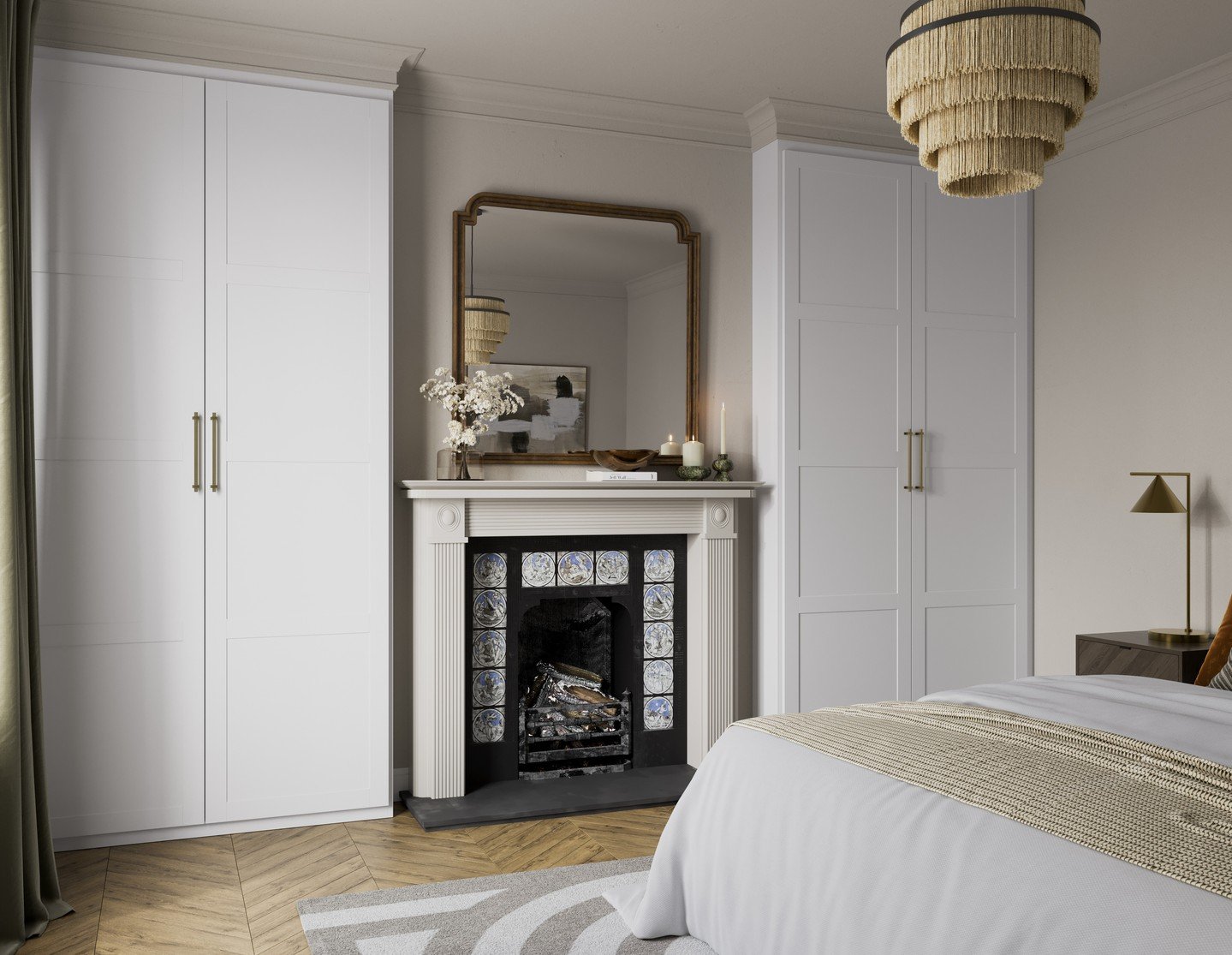 Pair of symmetrical white paneled built-in wardrobes flanking a traditional fireplace, featuring long brass bar handles in an elegant bedroom.