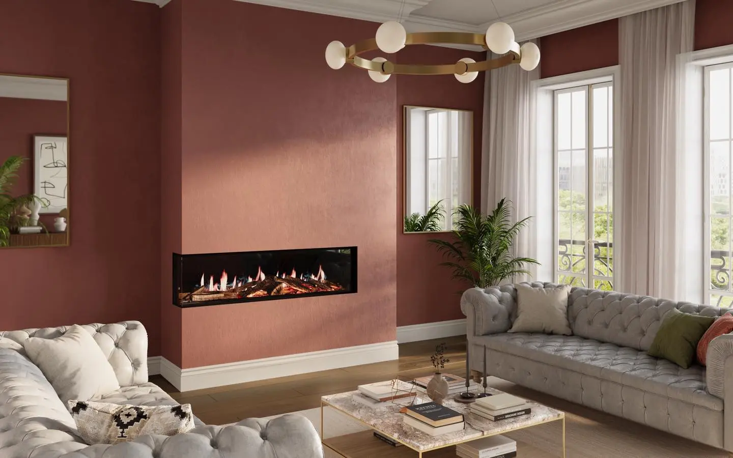 Extra-long linear electric fireplace installed in the corner of a chimney breast painted in a textured terracotta or burnt orange color, with a gray tufted sofa nearby.