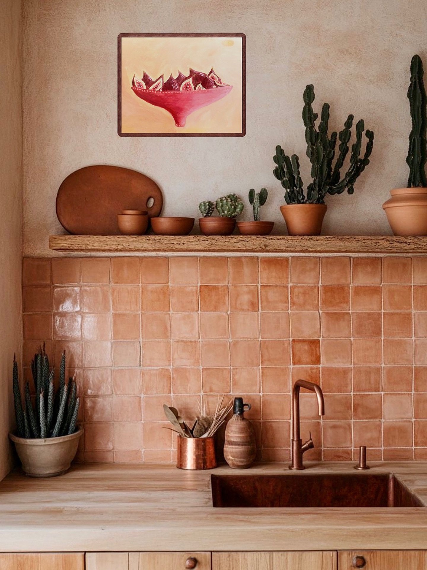 A set of simple, minimalist framed line drawings displayed in a light-filled kitchen with a wooden island.