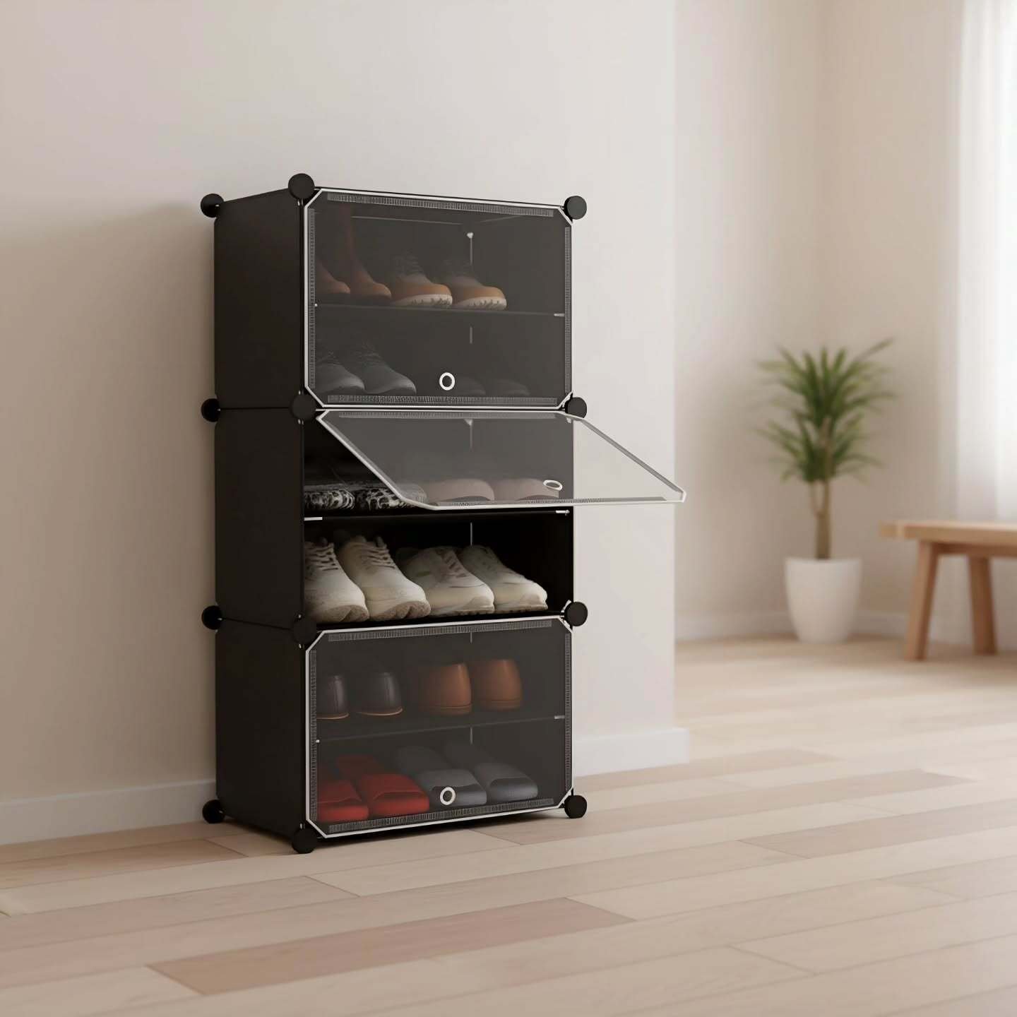 Stack of three black modular plastic cubes with transparent doors, storing shoes in a neat entryway.