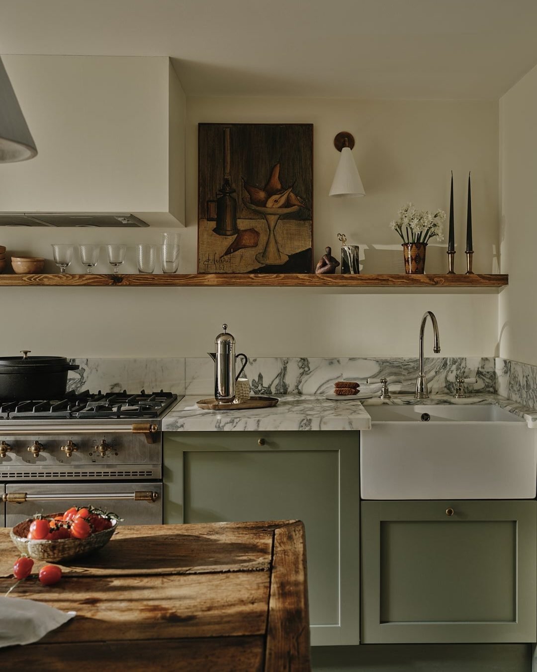 A unique, three-dimensional sculptural wall art piece displayed in a contemporary kitchen with dark cabinetry.