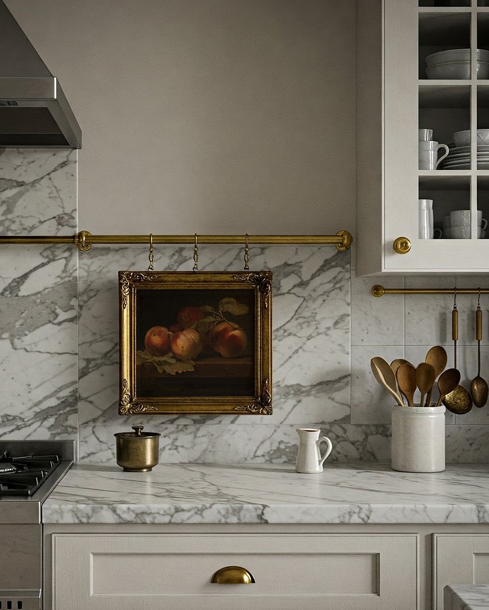 A large framed vintage-style advertising poster hanging in a bright, contemporary kitchen with white cabinets.