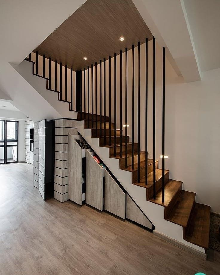 Minimalist staircase with individual pull-out drawers built directly into the risers.