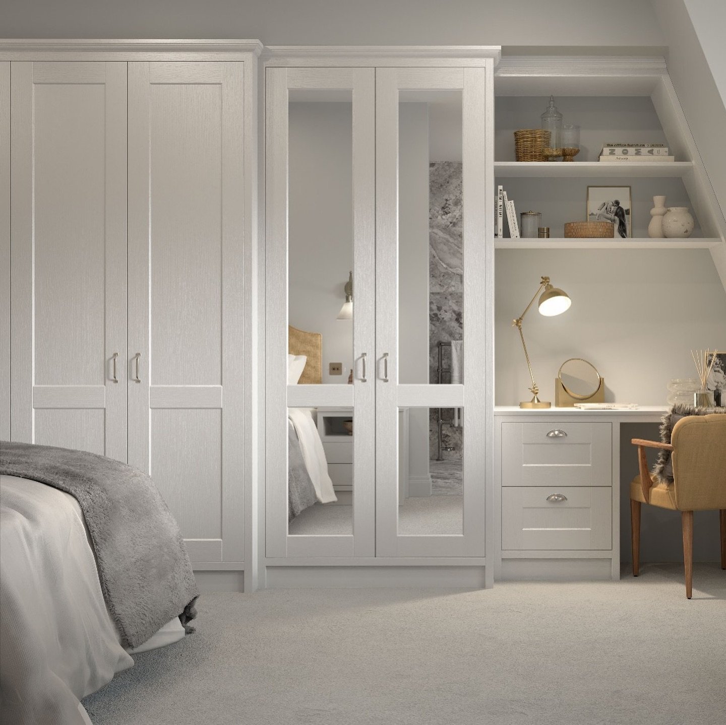 Light gray paneled wardrobe with a central mirrored unit and an integrated desk area with open shelving and drawers under a sloped roof.