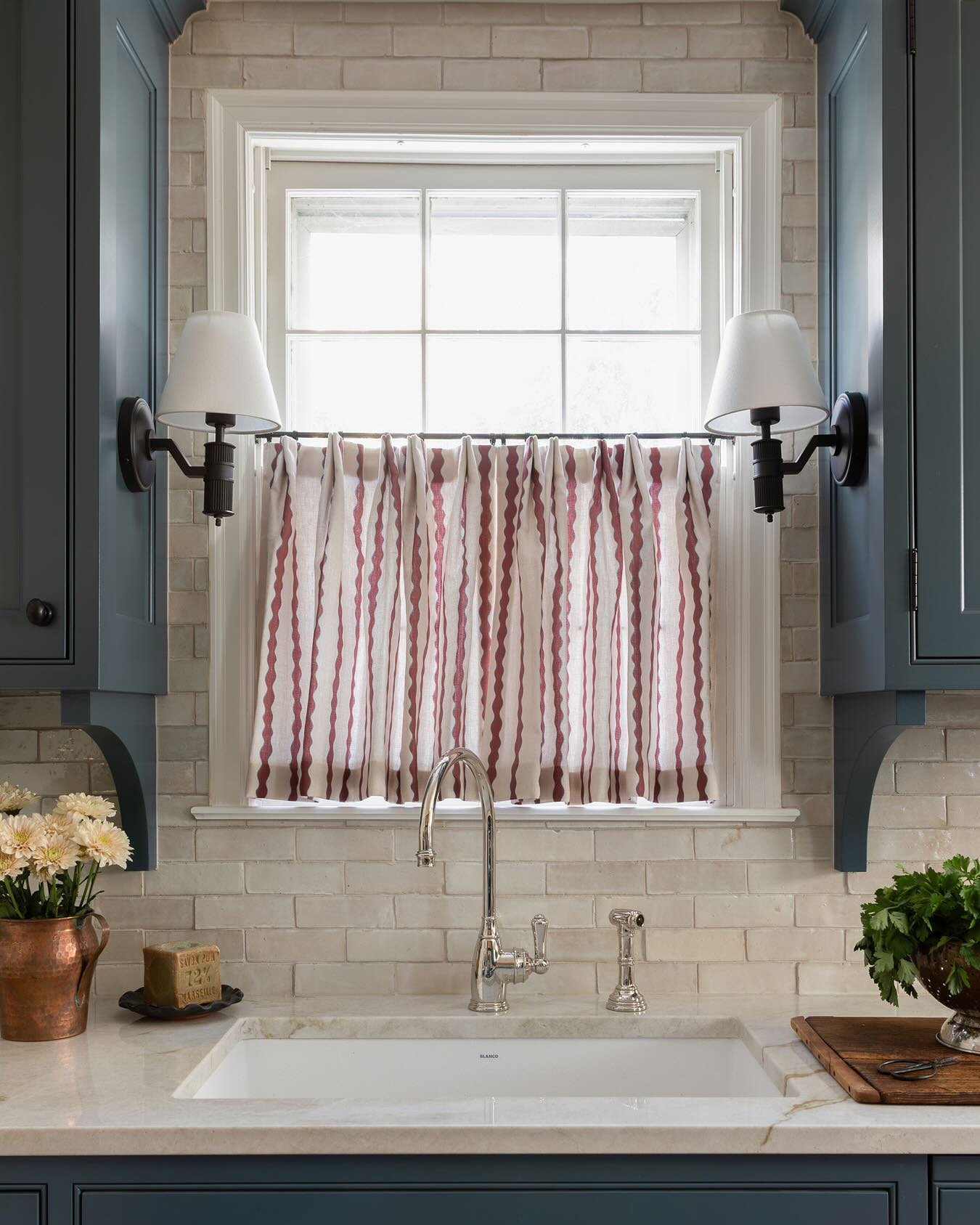 Warm-toned natural wood slat blinds installed inside the window frame.