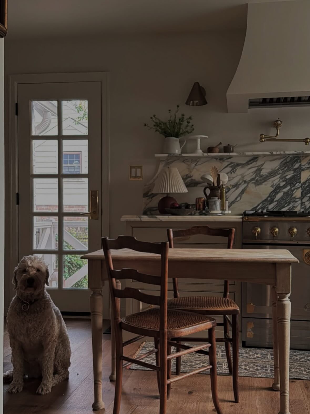 Small light wood kitchen table with turned legs and vintage chairs