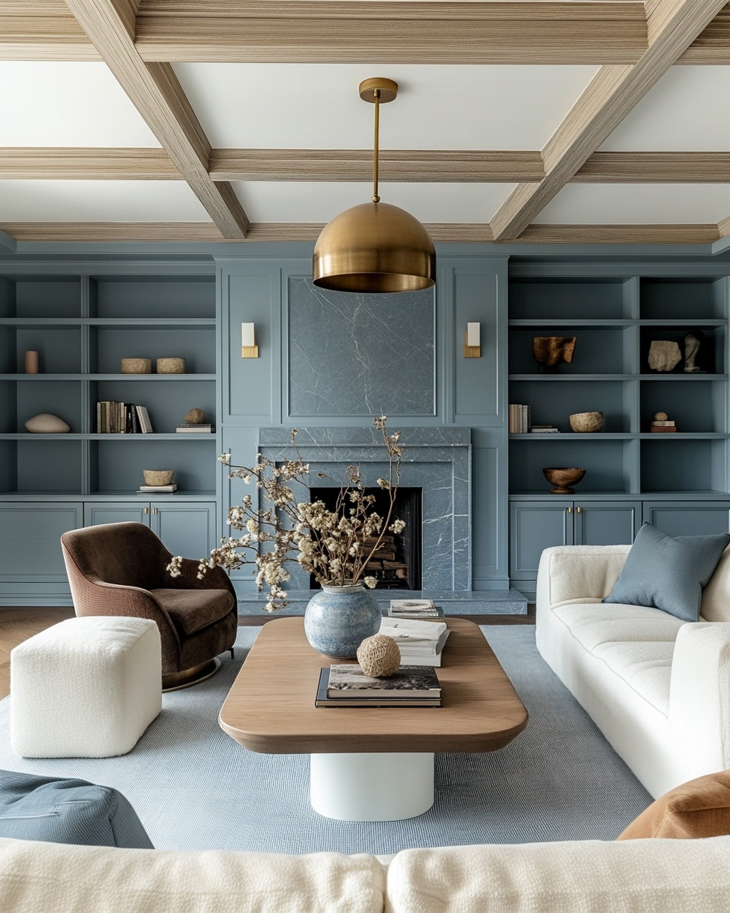 Dusty blue accent wall featuring floor-to-ceiling built-in shelves and a matching stone fireplace