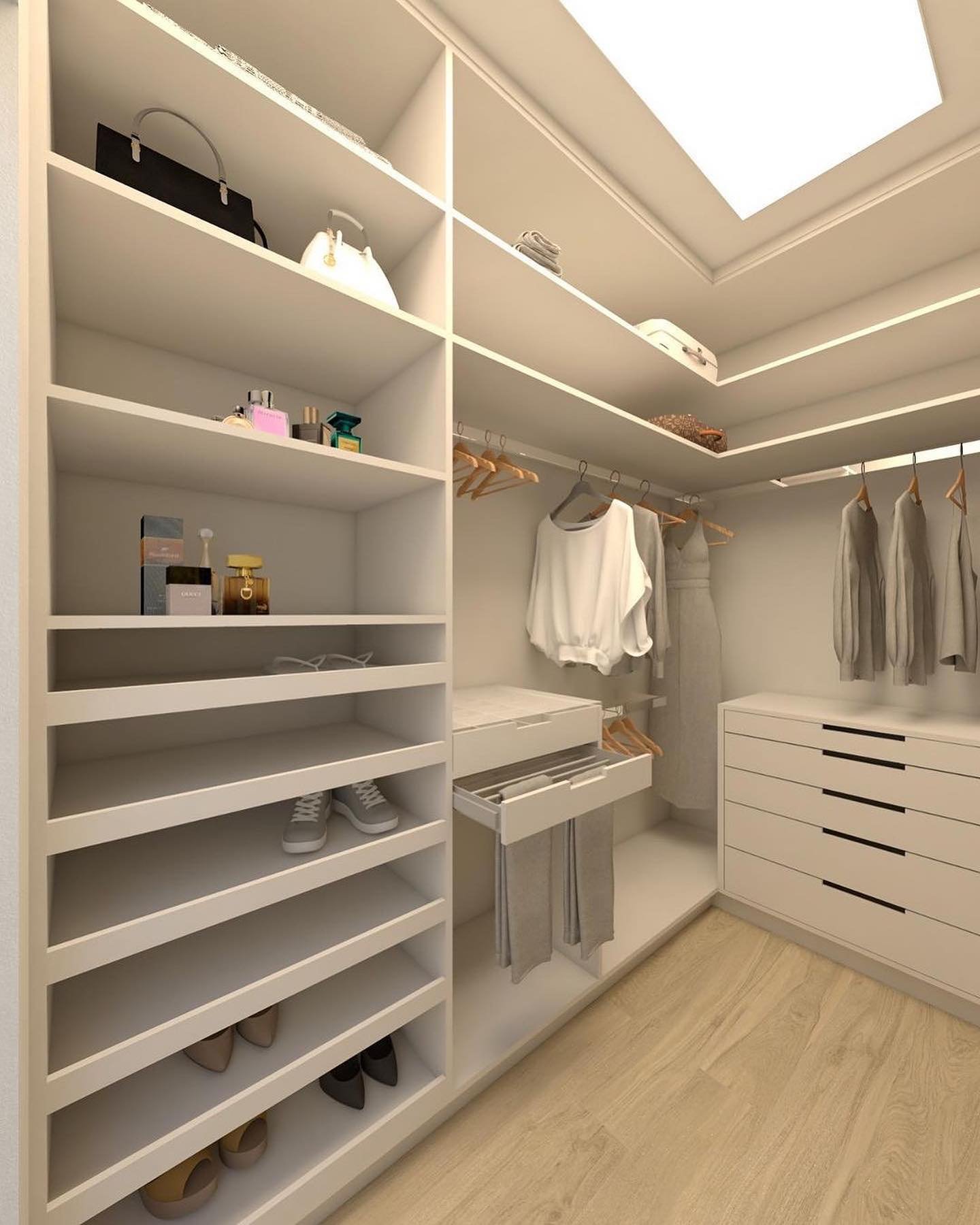 A modern walk-in closet with seamless white shelving, custom pull-out drawers for trousers, and a rectangular ceiling light panel.
