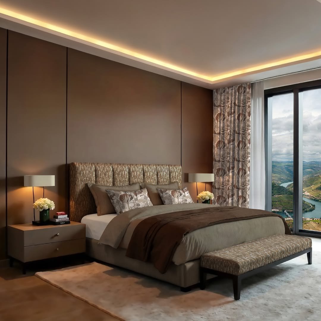 Modern brown bedroom featuring cove ceiling lighting, a patterned headboard, and floor-to-ceiling window drapes