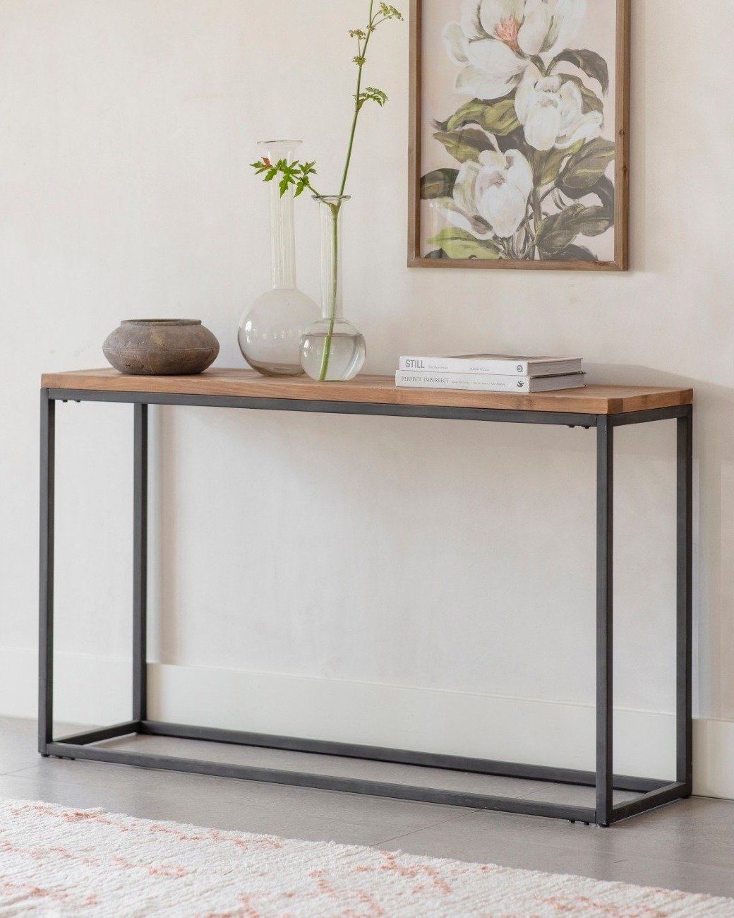 Rectangular wood and black metal hallway table with vases