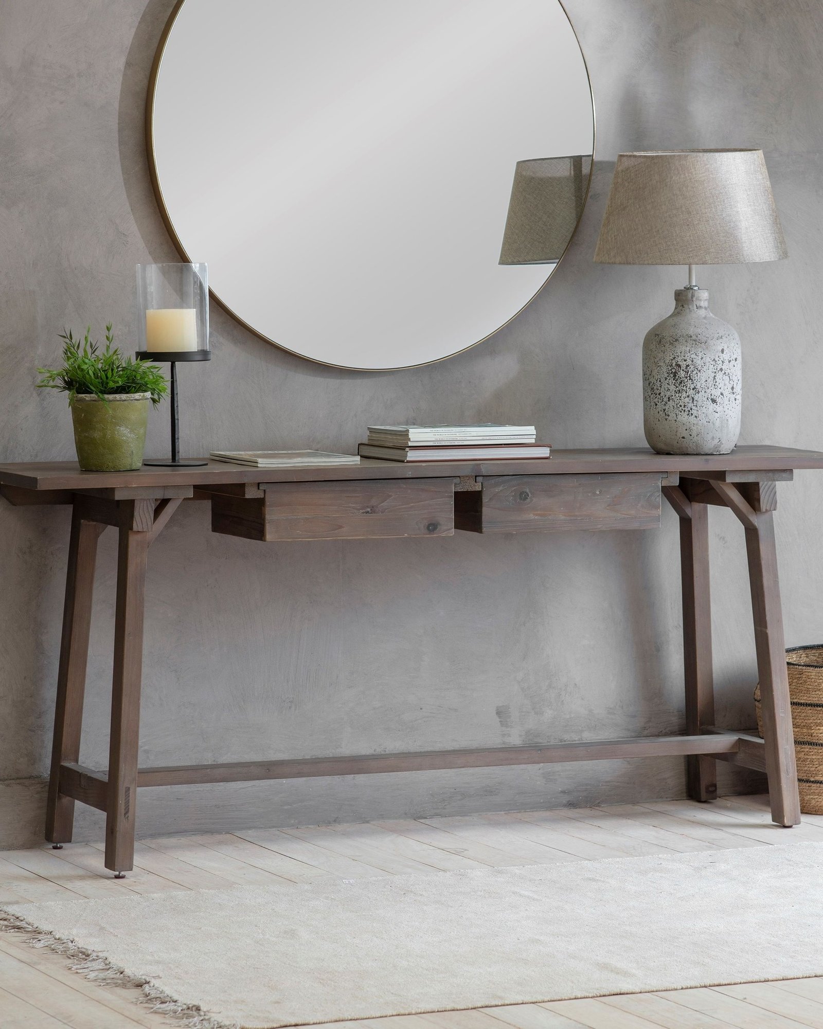 Long dark wood hallway table with drawers and round mirror
