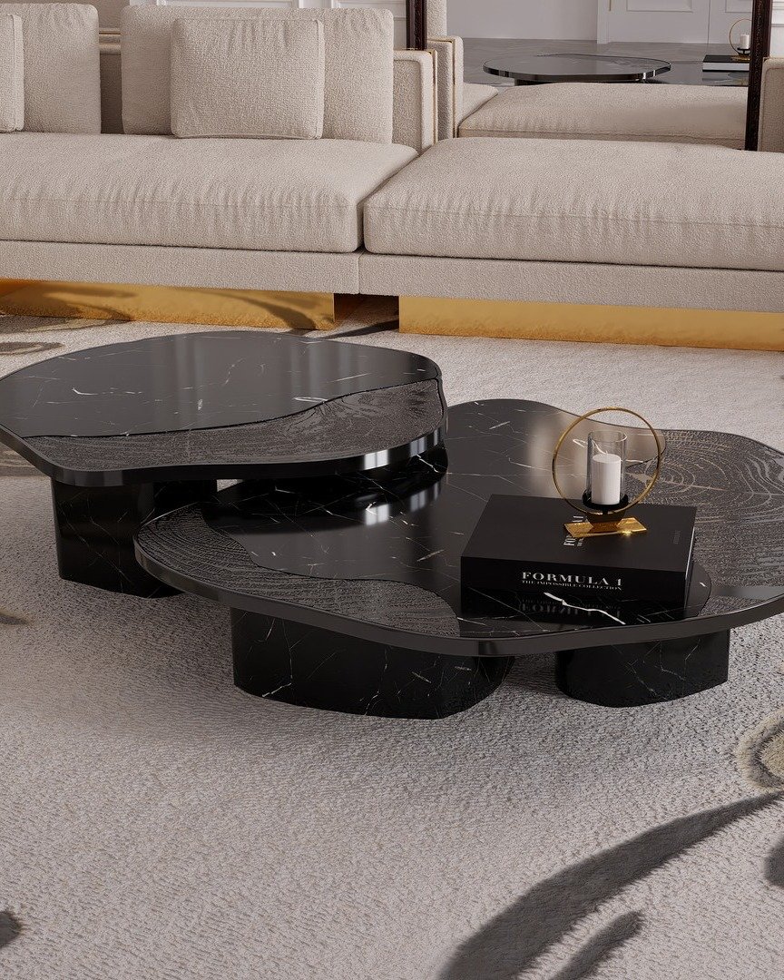 Two layered black marble coffee tables with mixed textures in a luxury living room