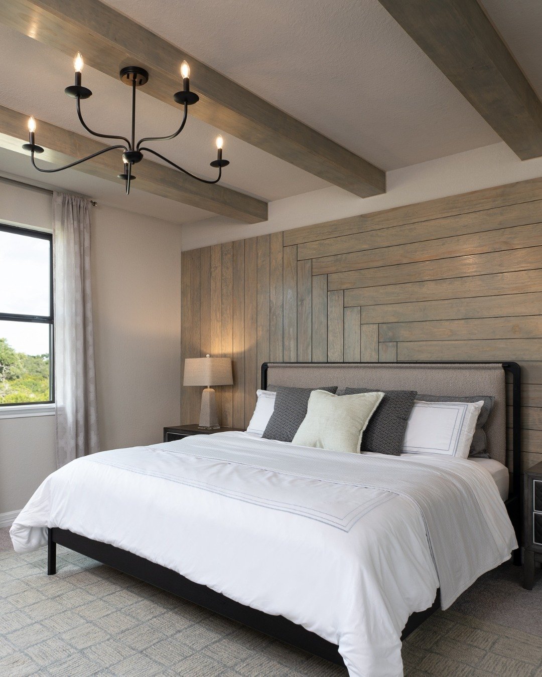 Gray wood accent wall featuring a combination of vertical and horizontal board patterns.