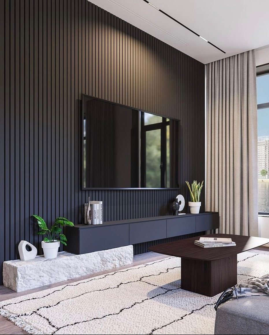 Full wall black wood slats with dark floating console and white stone accent block.