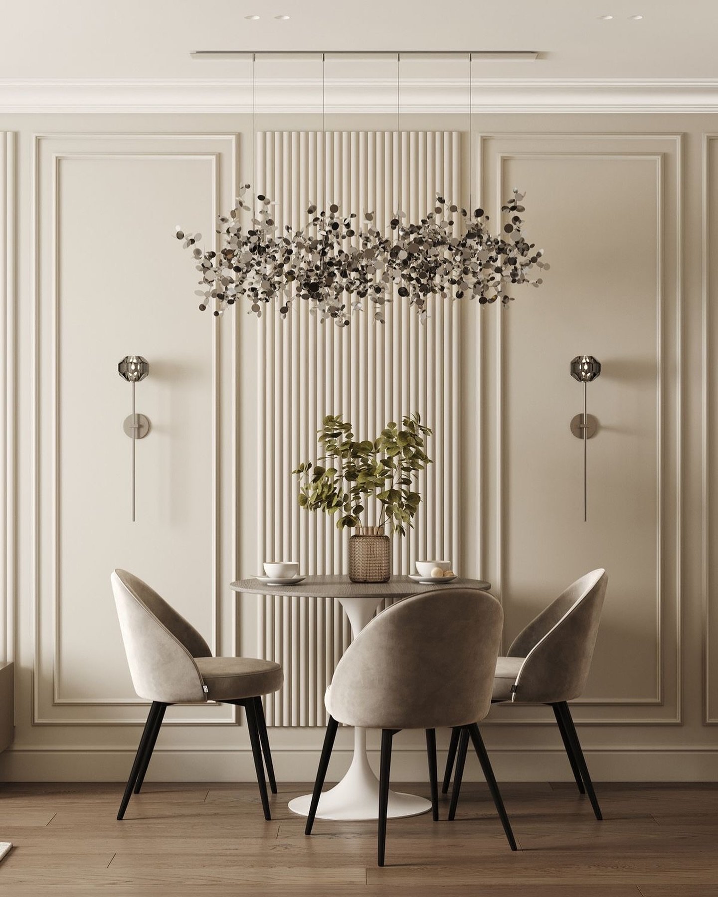 Beige dining room wall featuring central vertical fluted paneling and leafy silver chandelier