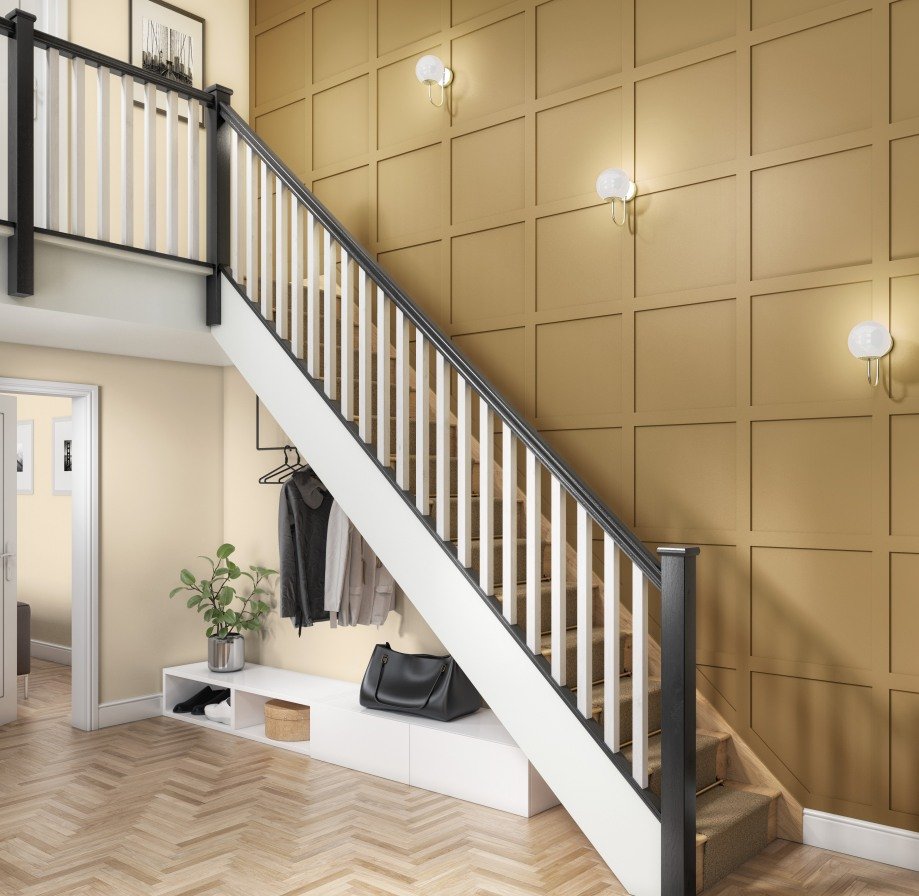 Staircase accent wall featuring mustard yellow grid paneling, white globe sconces, and under-stairs storage.
